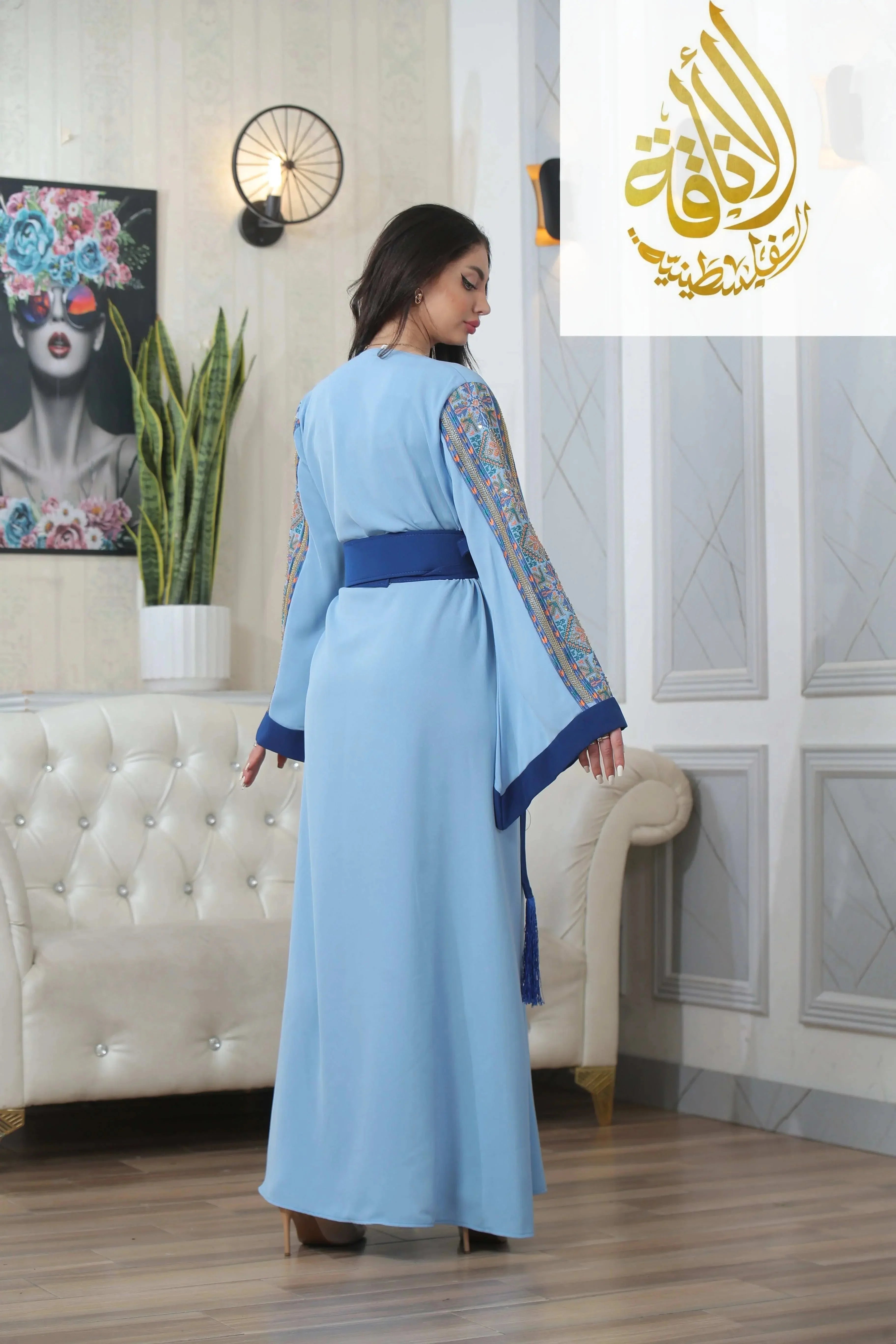 Baby Blue Unique Embroidered Thoub by Palestinian Elegance with long sleeves and detailed sleeve embroidery