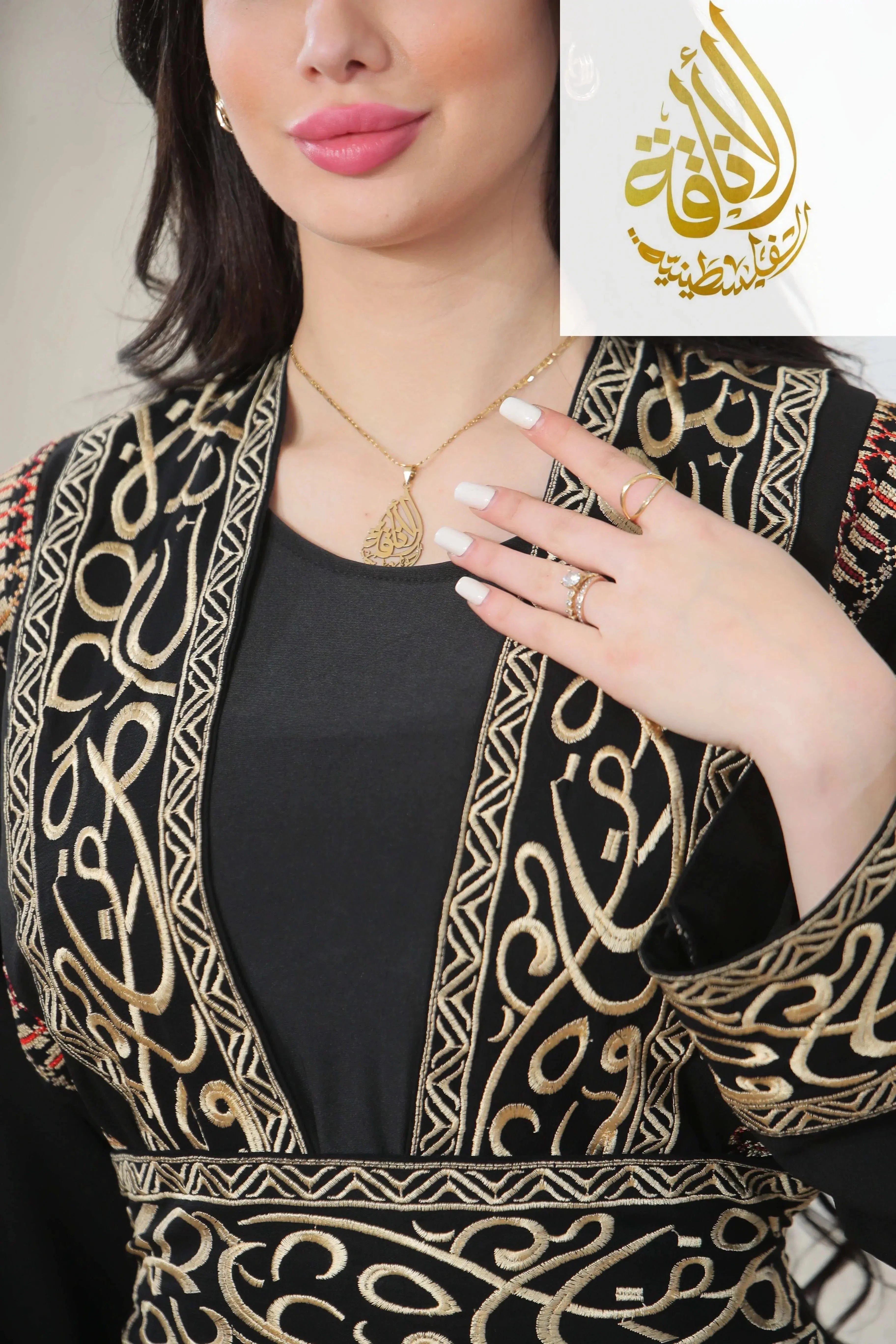 Palestinian Elegance Basma Arabic letters with heritage embroidery Bisht thoub in black with intricate gold stitching
