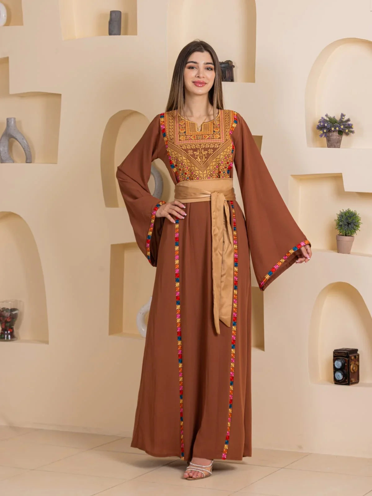 Blossom Embroidered Thobe by Palestinian Elegance brown abaya style with gold sash and colorful floral embroidery