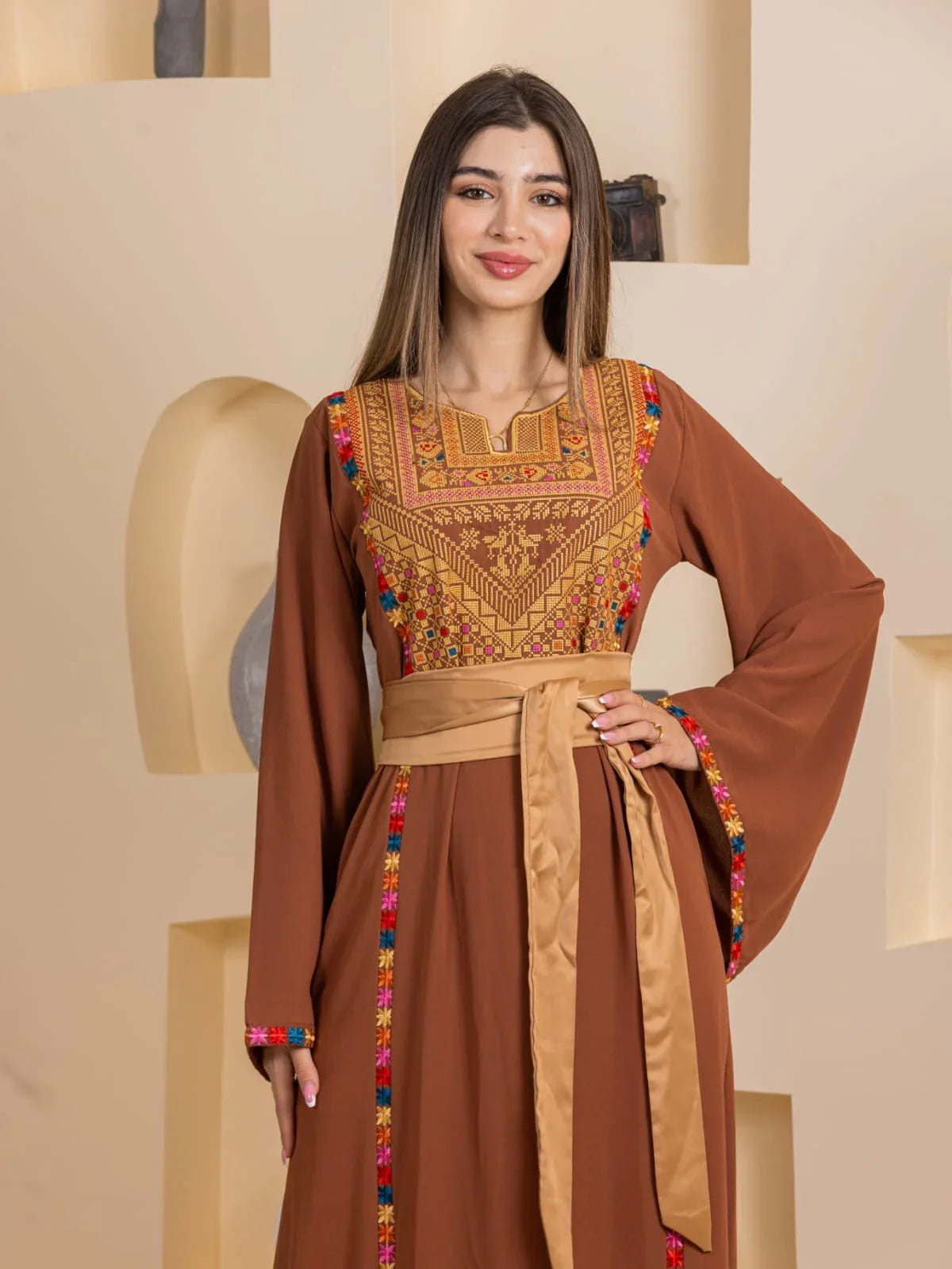 Blossom Embroidered Thobe by Palestinian Elegance in brown with colorful floral chest embroidery wide sleeves and sash belt