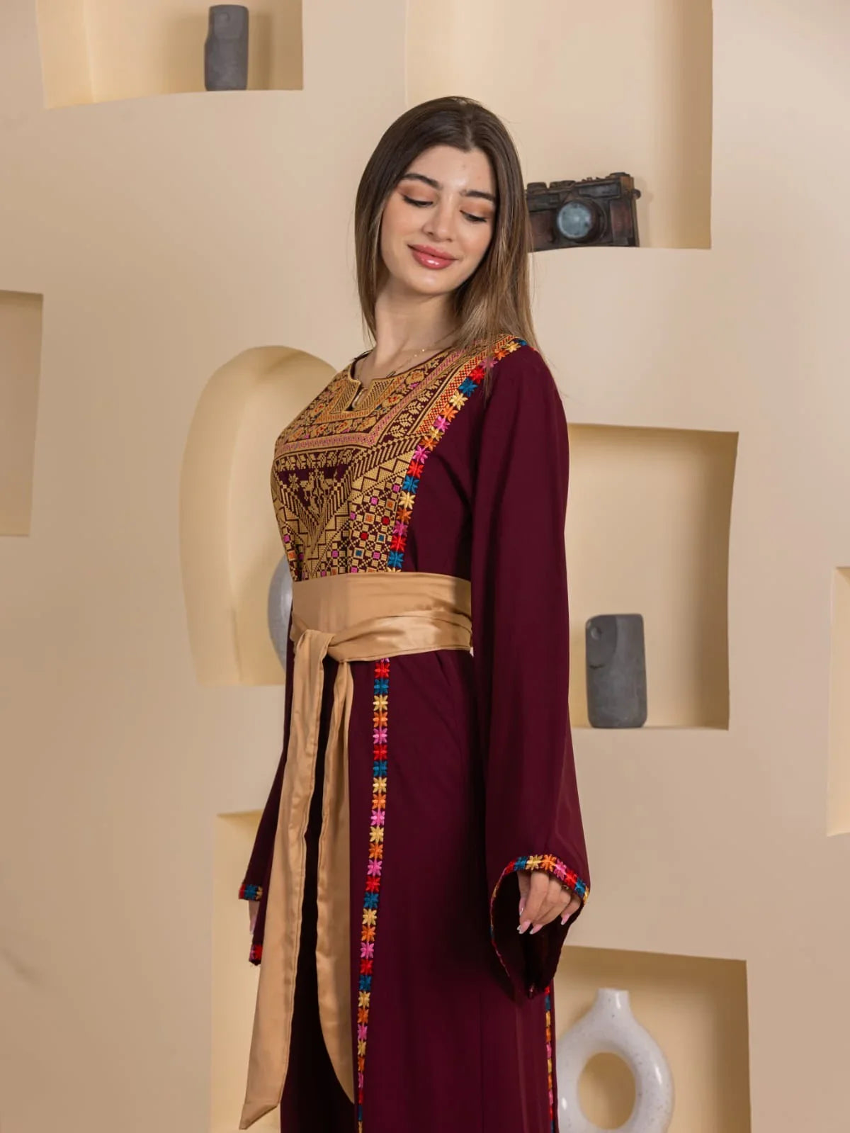 Palestinian Elegance Blossom Embroidered Thobe maroon long sleeve with colorful chest embroidery and gold sash