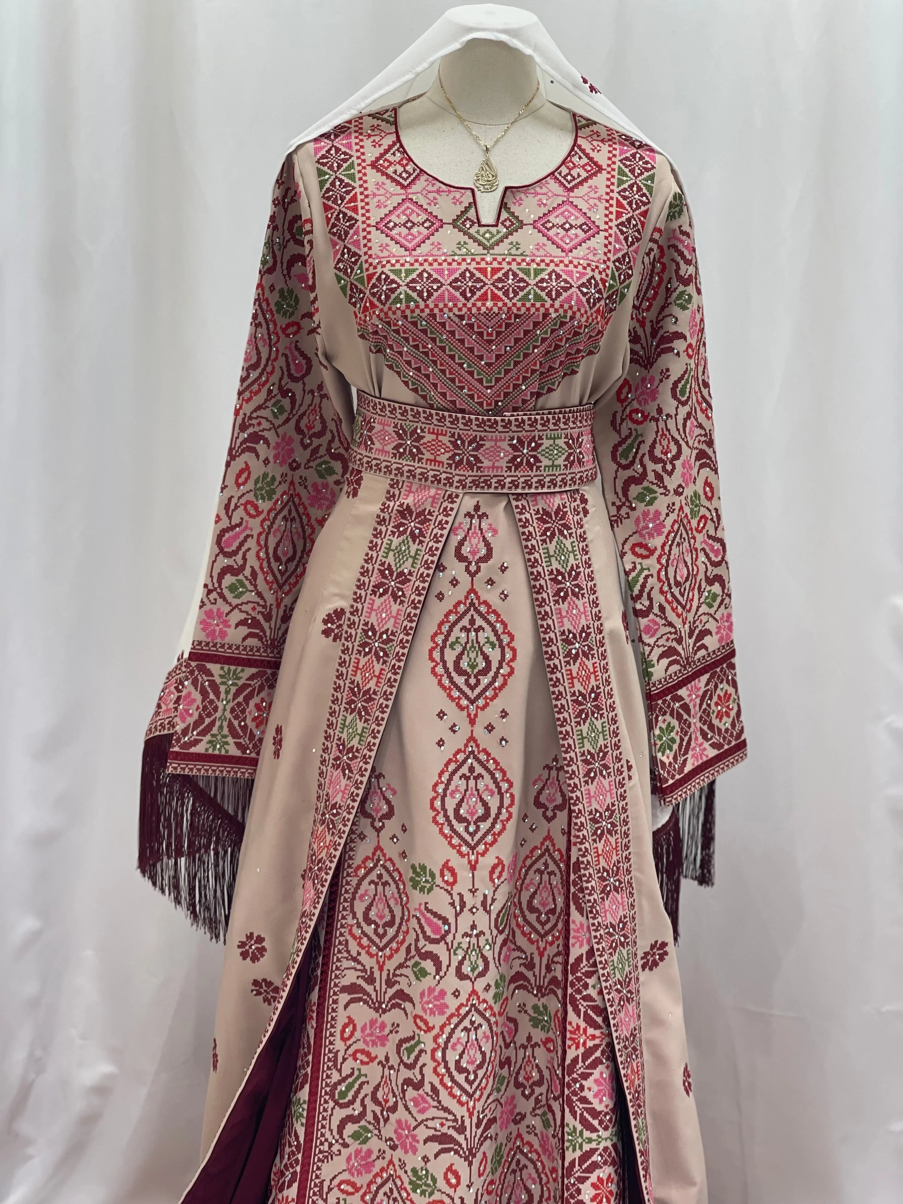 Palestinian Bride of Roses Thobe featuring intricate embroidery and elegant design for special occasions