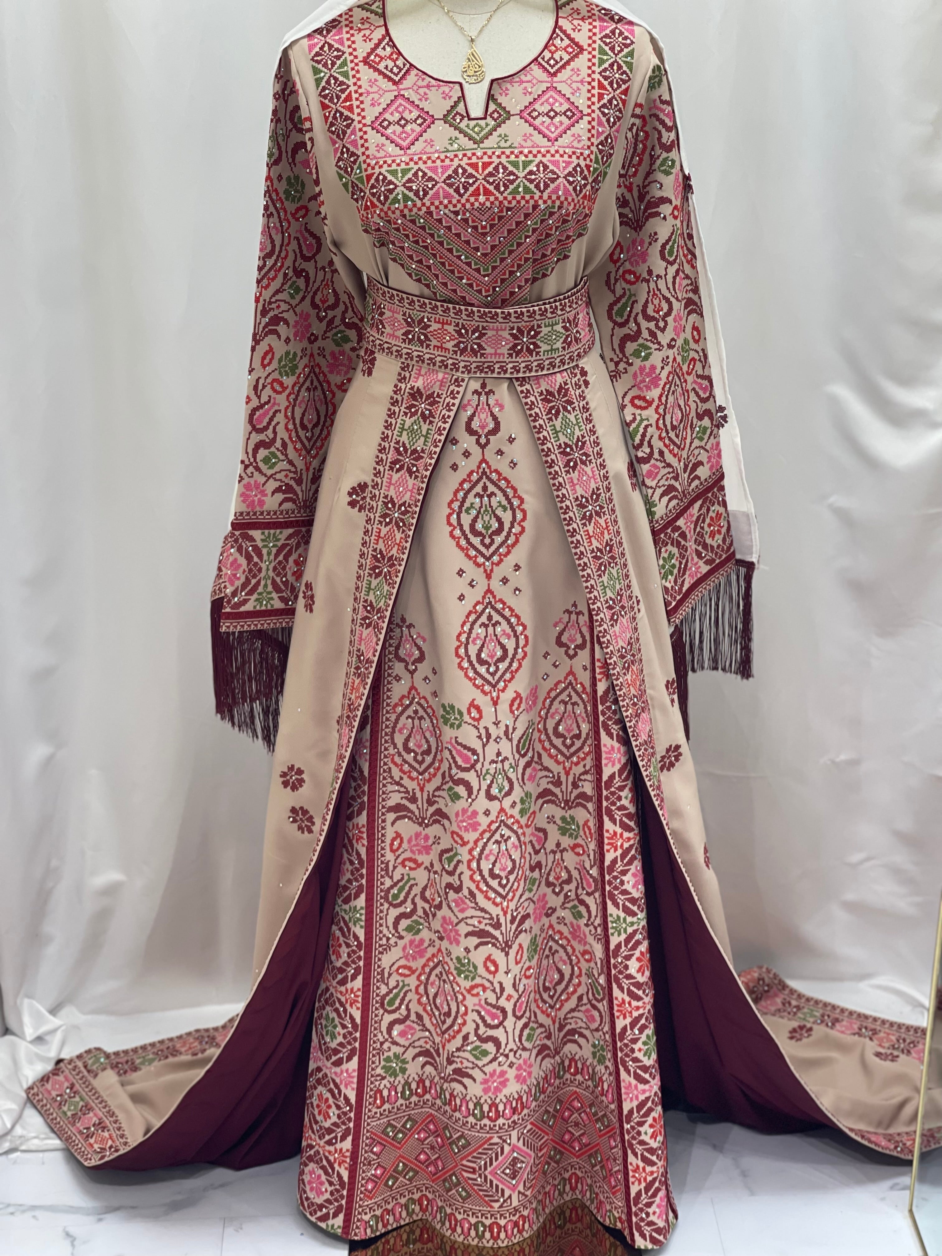 Bride of Roses Thobe featuring intricate embroidery in pink and green on a flowing design