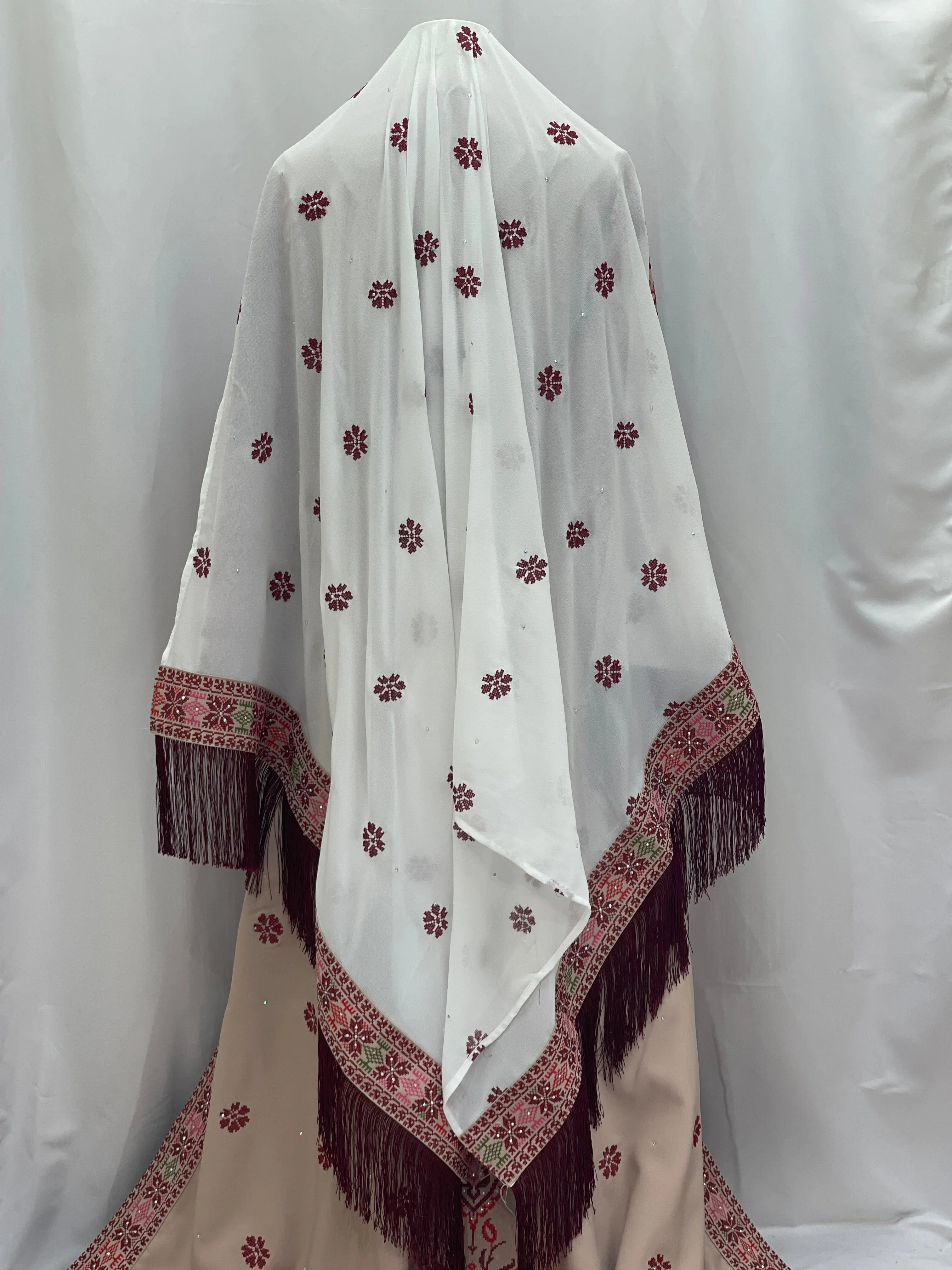 Bride of Roses Thobe featuring intricate floral embroidery and elegant fringed design