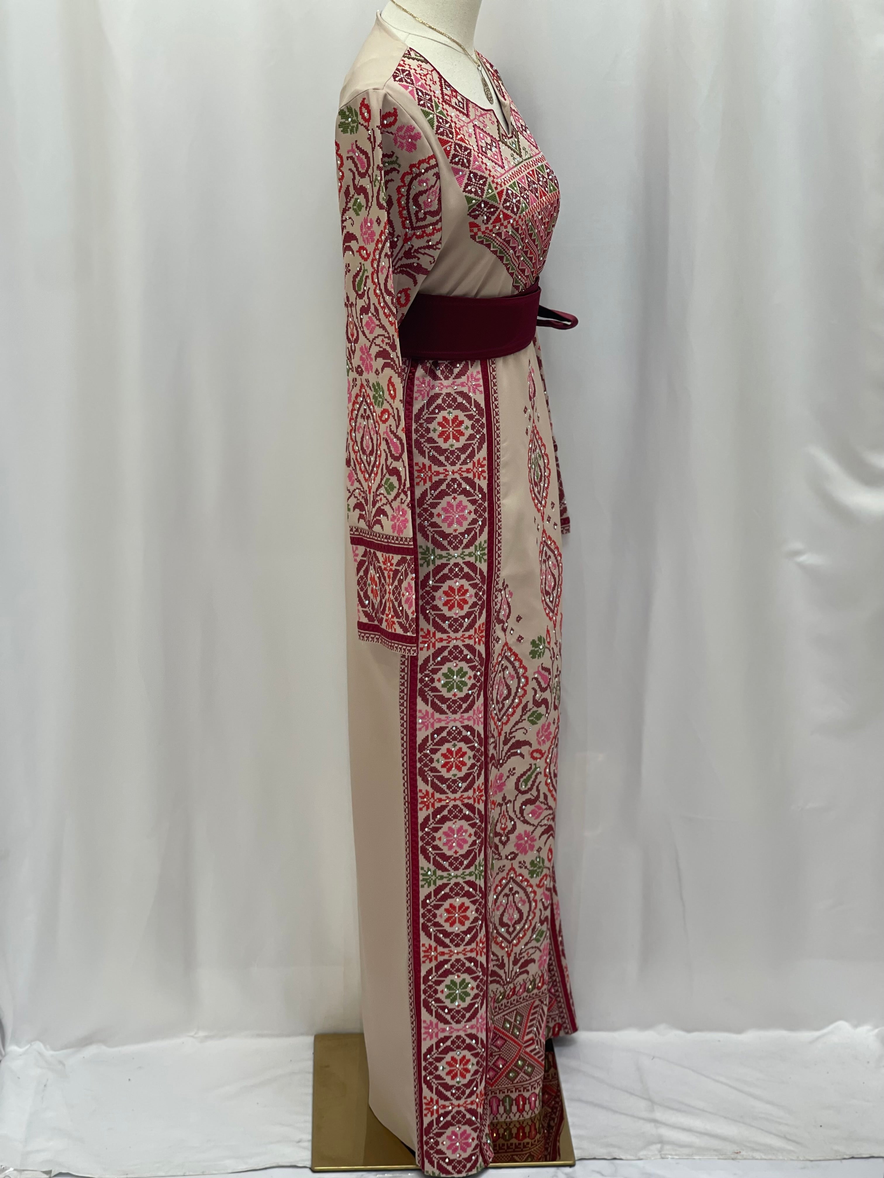 Bride of Roses Thobe featuring intricate floral embroidery and a stylish belted design