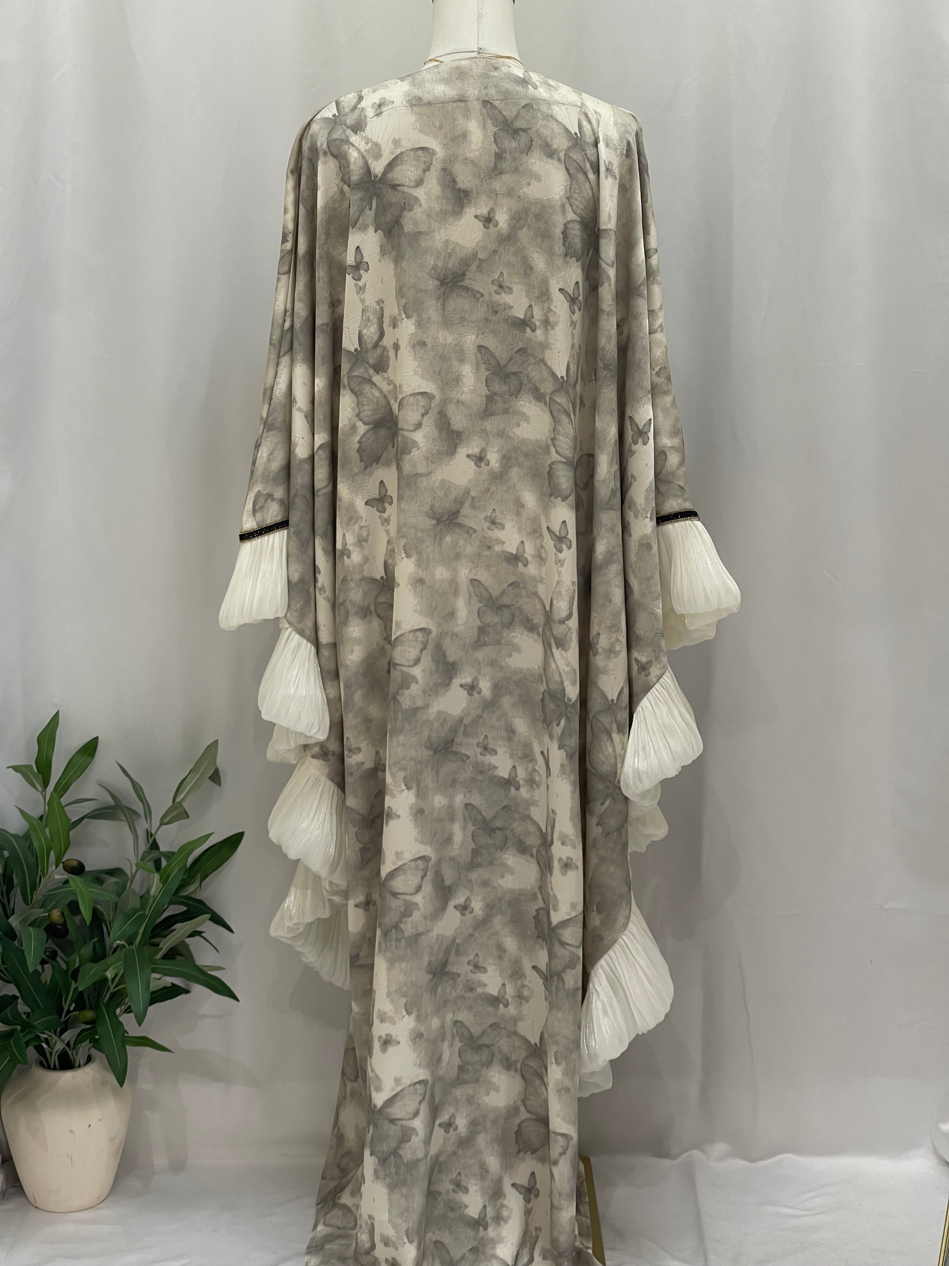 Butterfly abaya free size from Palestinian Elegance with butterfly print and white layered sleeves