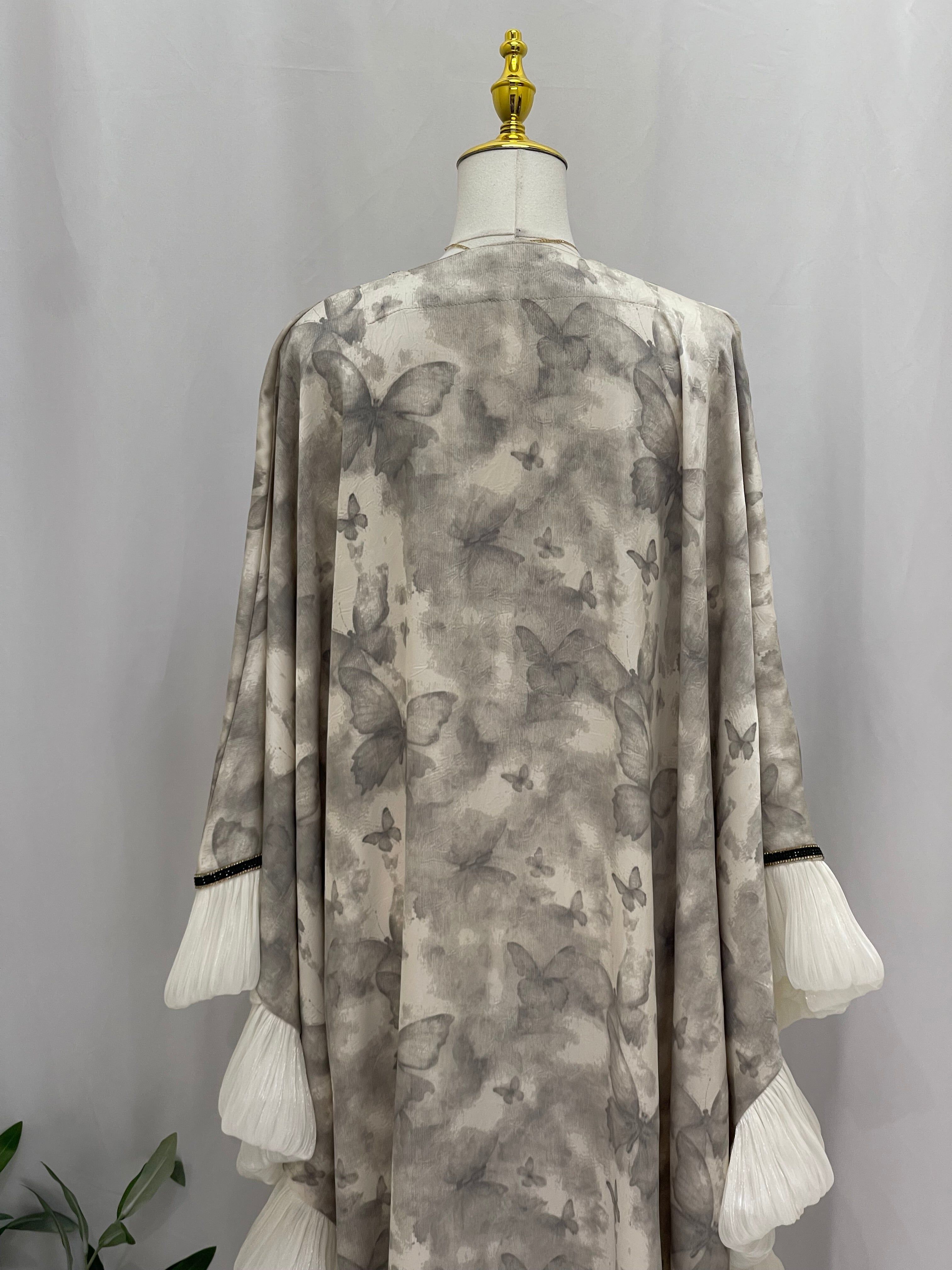 Palestinian Elegance butterfly abaya free size with soft gray butterfly print and white pleated sleeve details