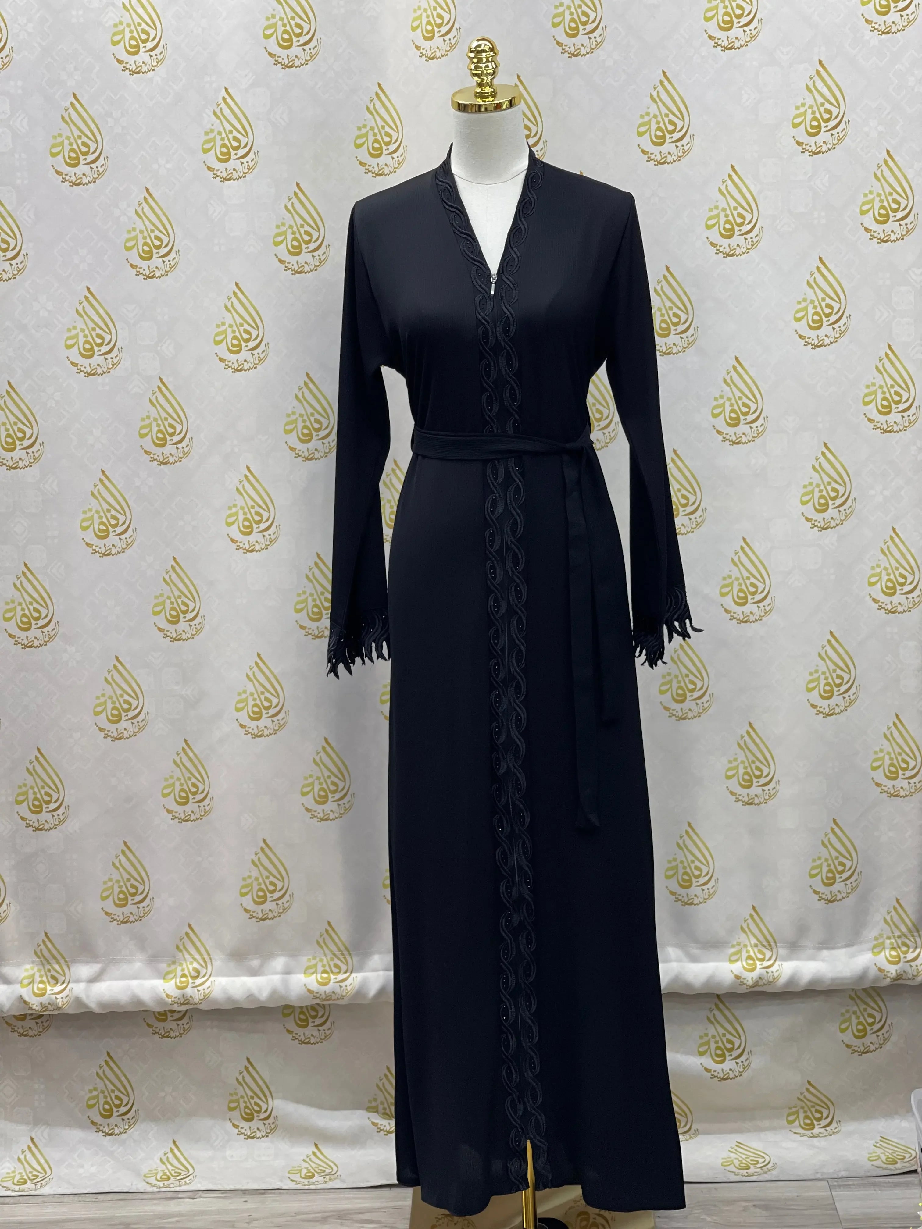 Elegant embroidered abaya in black with long sleeves and waist belt by Palestinian Elegance
