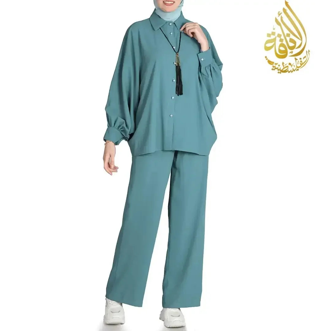 Palestinian Elegance chic summer outfit for women with loose teal top and matching wide-leg pants