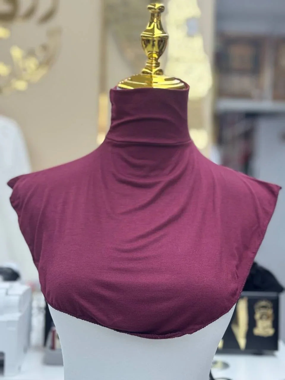 Palestinian Elegance maroon Cotton Lightweight Turtle Neck displayed on gold top mannequin torso