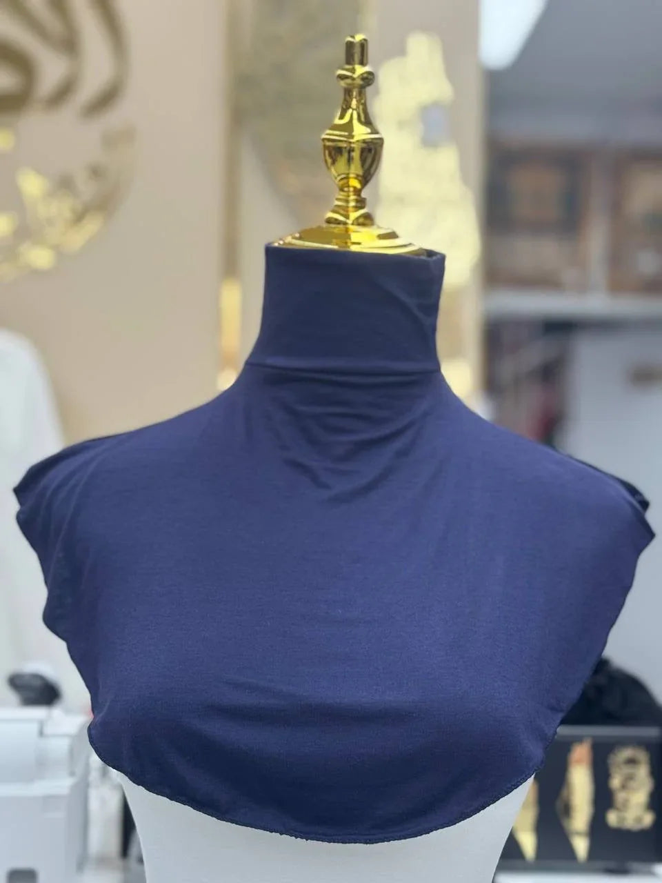 Palestinian Elegance navy blue Cotton Lightweight Turtle Neck displayed on mannequin for layering and warmth