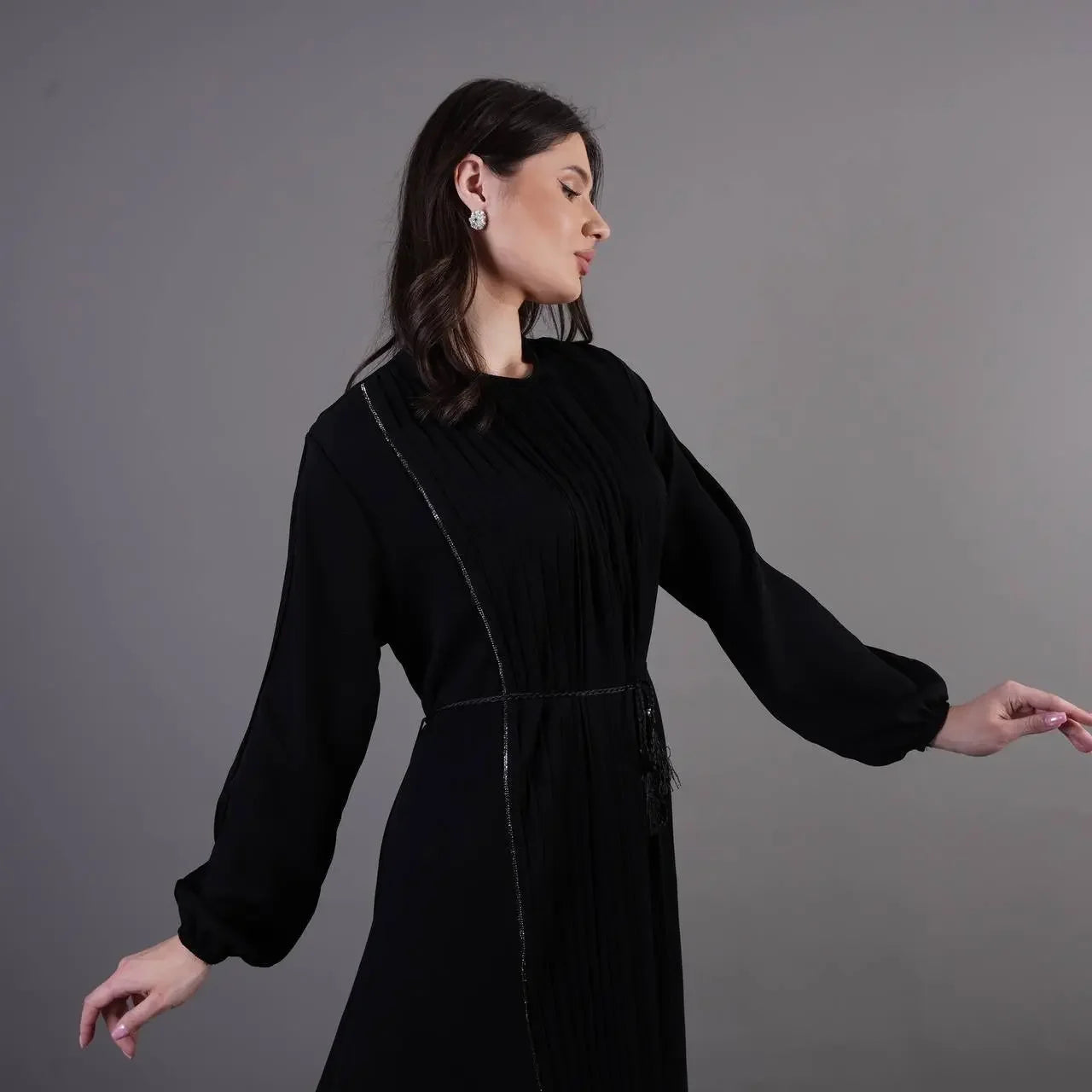 Palestinian Elegance black pleated abaya dress with long sleeves and subtle waist detailing