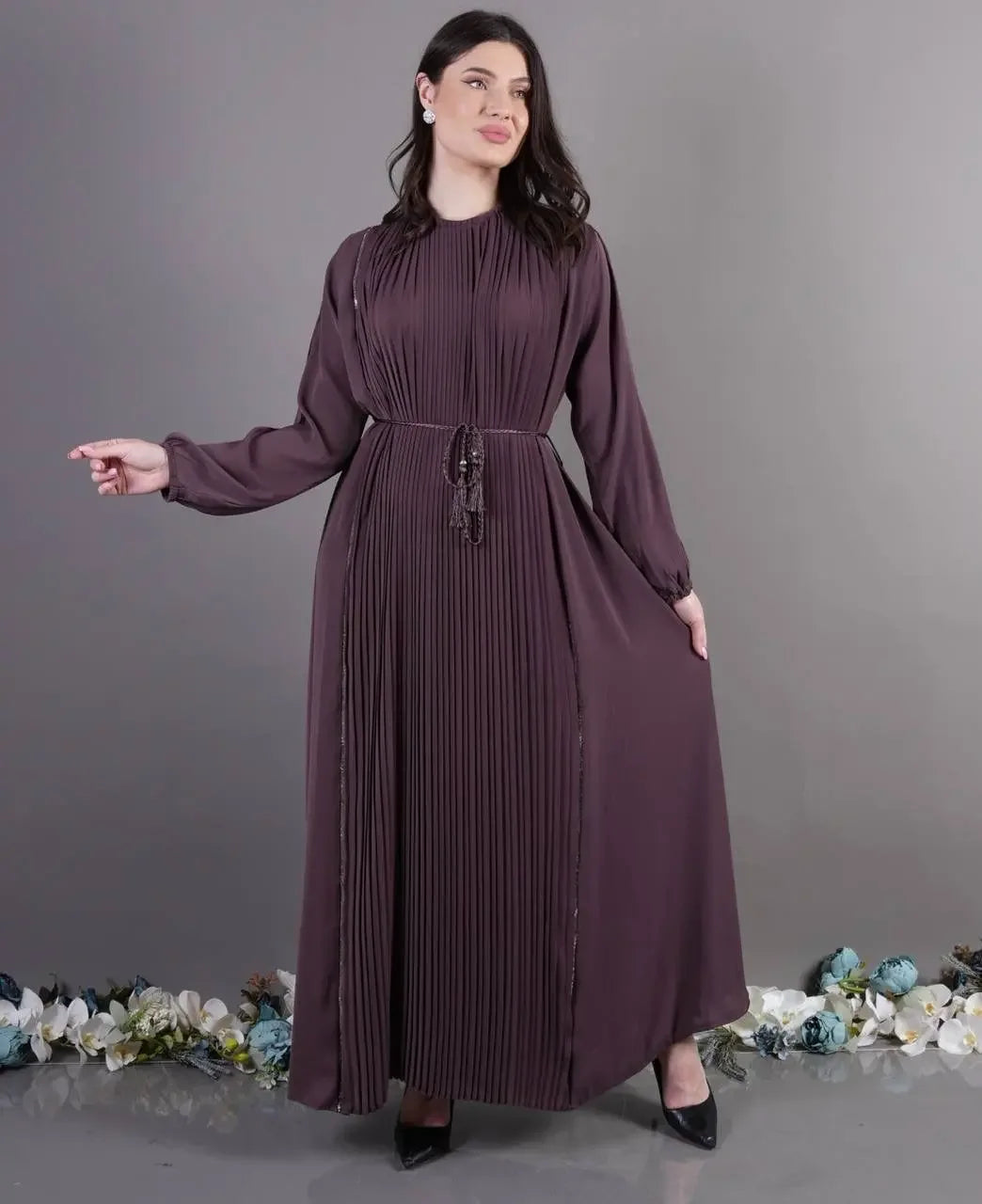 Palestinian Elegance pleated abaya dress in deep purple with long sleeves and cinched waist