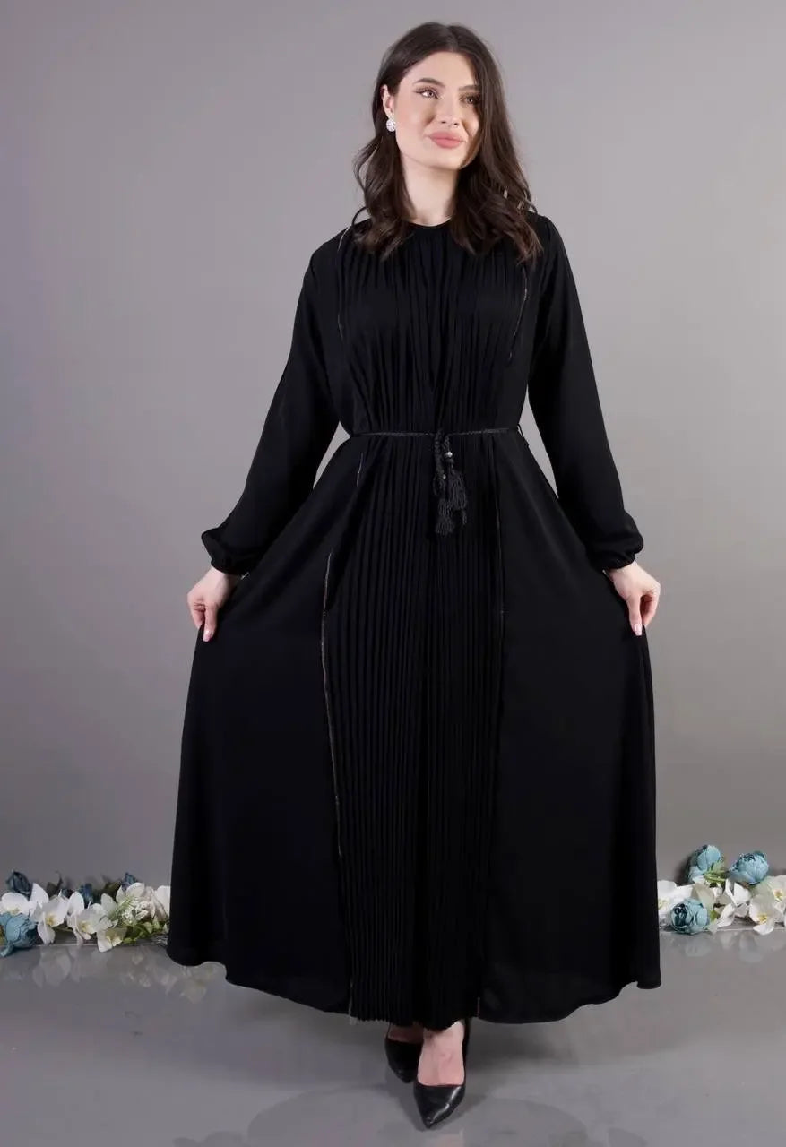 Palestinian Elegance pleated abaya dress in black with long sleeves and waist tassel belt