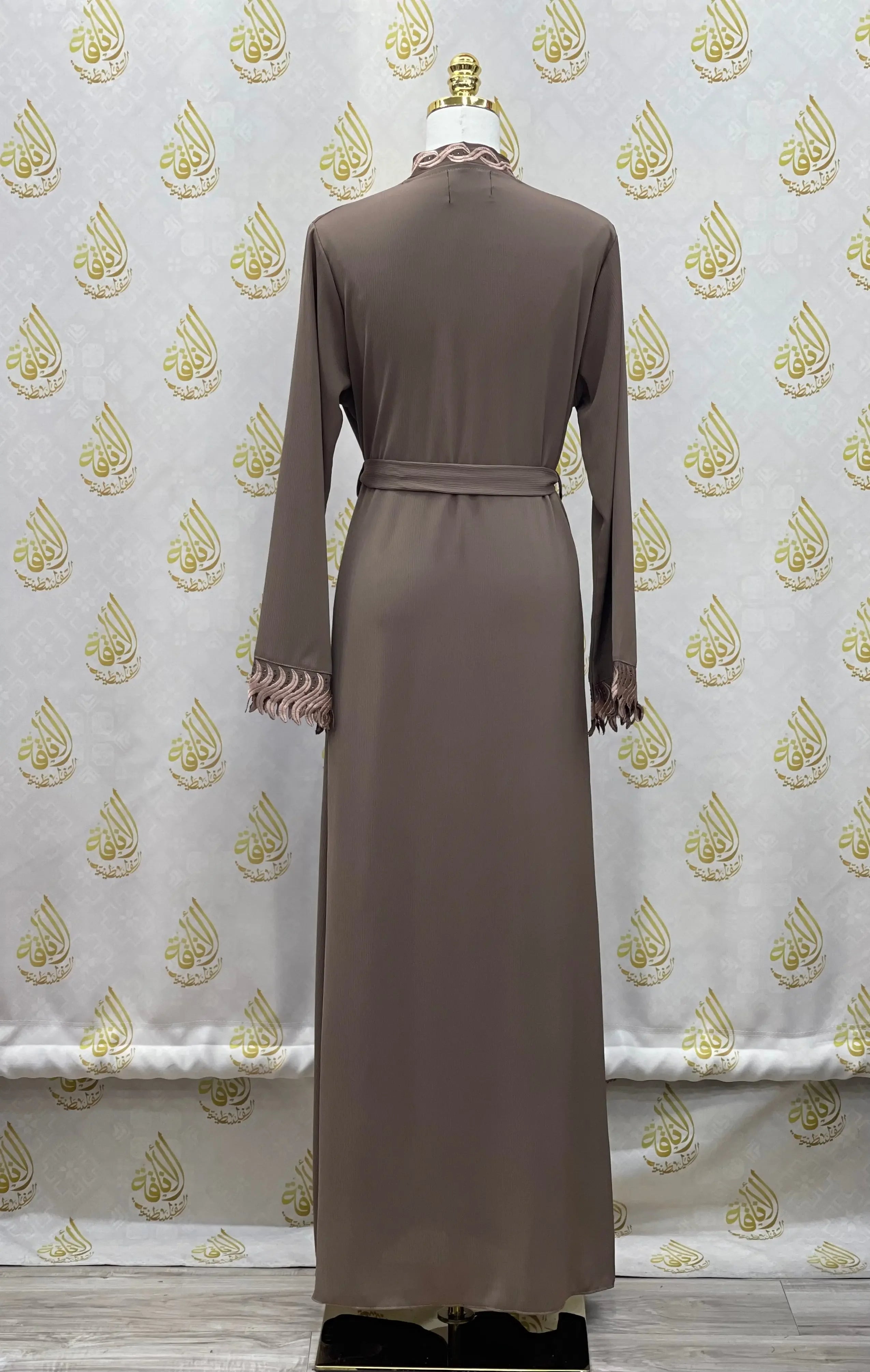 Palestinian Elegance elegant embroidered abaya in brown with long sleeves and delicate cuff detailing
