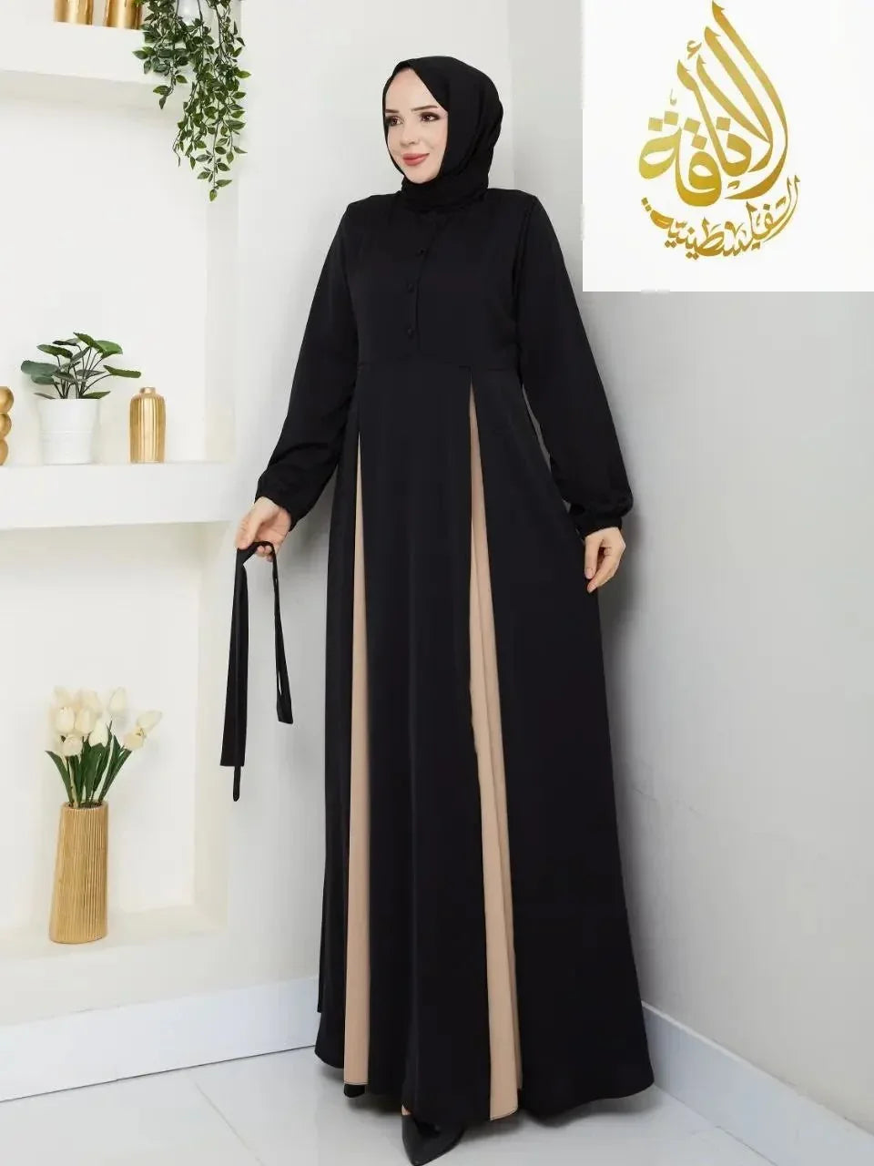 Palestinian Elegance elegant formal long dress with black and beige panels worn with a black hijab