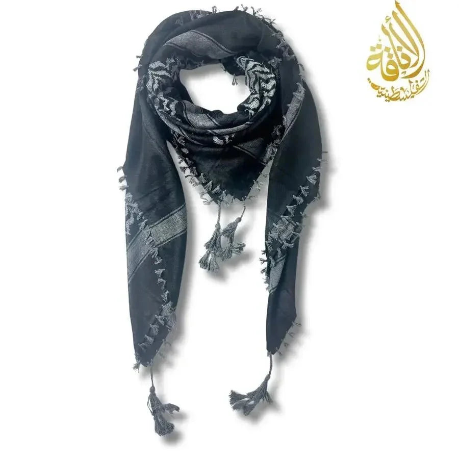 Black and gray patterned scarf with tassels on a white background