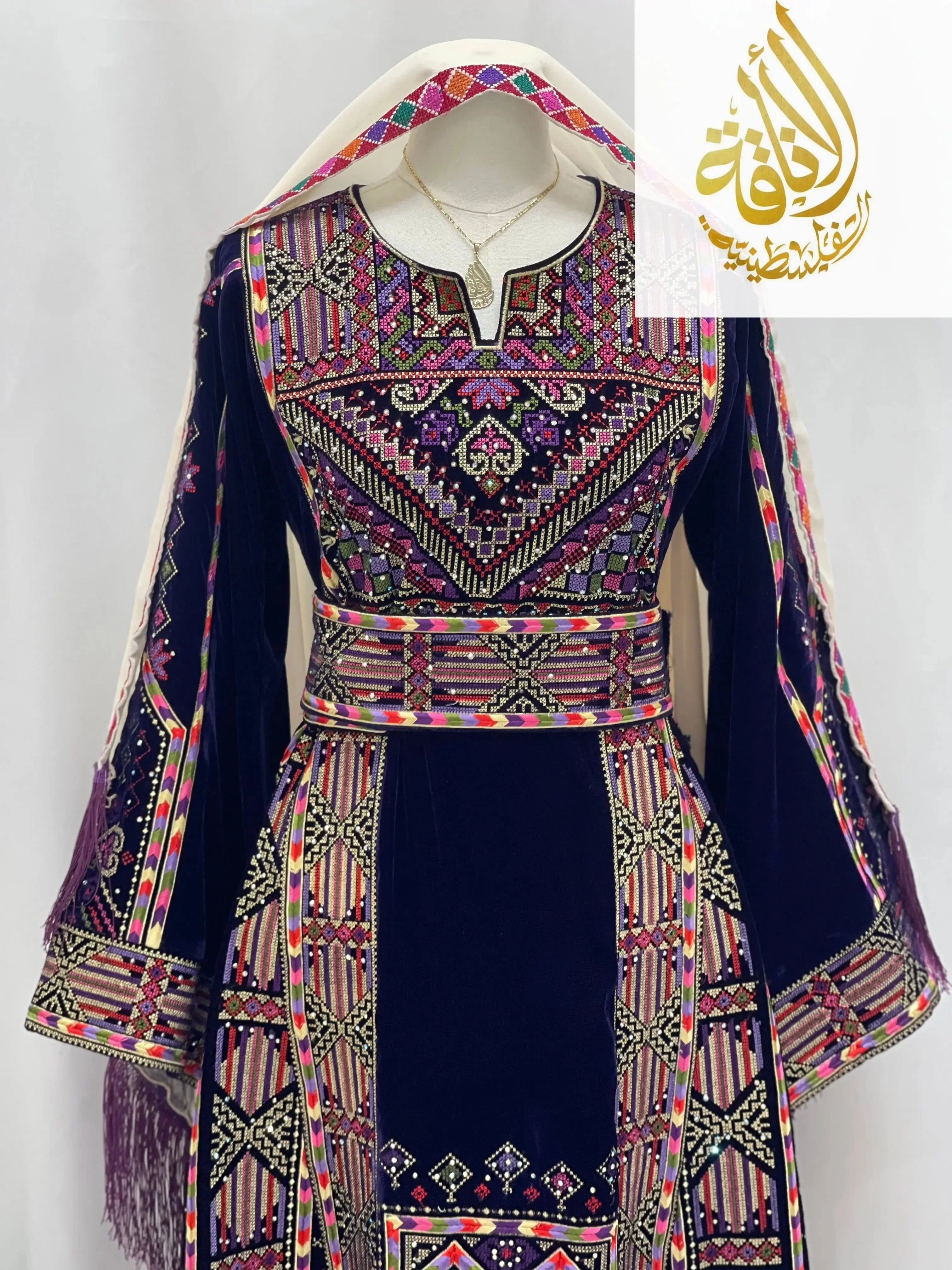 Palestinian Elegance embroidered velvet thoub with intricate colorful embroidery on dark blue velvet fabric