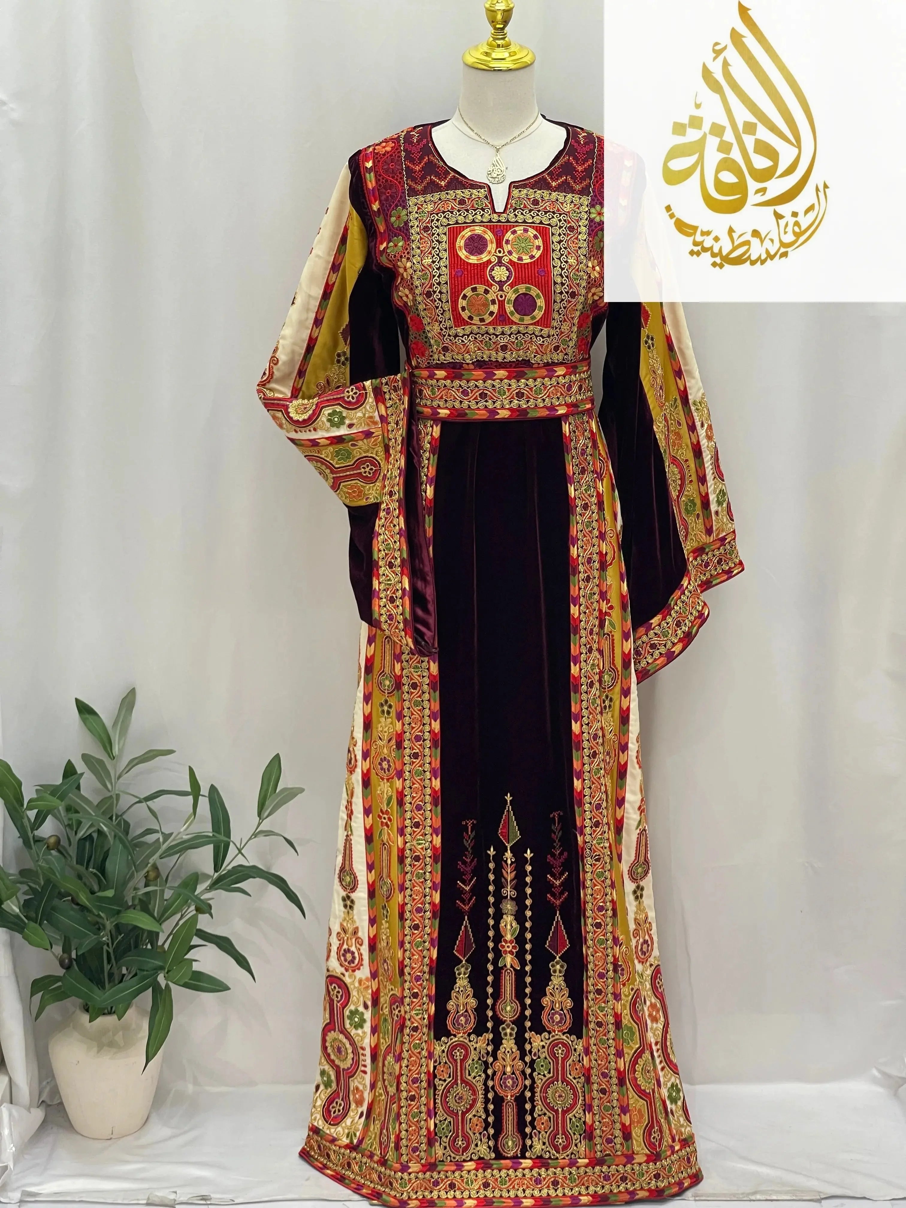 Deep Burgundy Palestinian Embroidered thobe with intricate gold and red traditional patterns by Palestinian Elegance