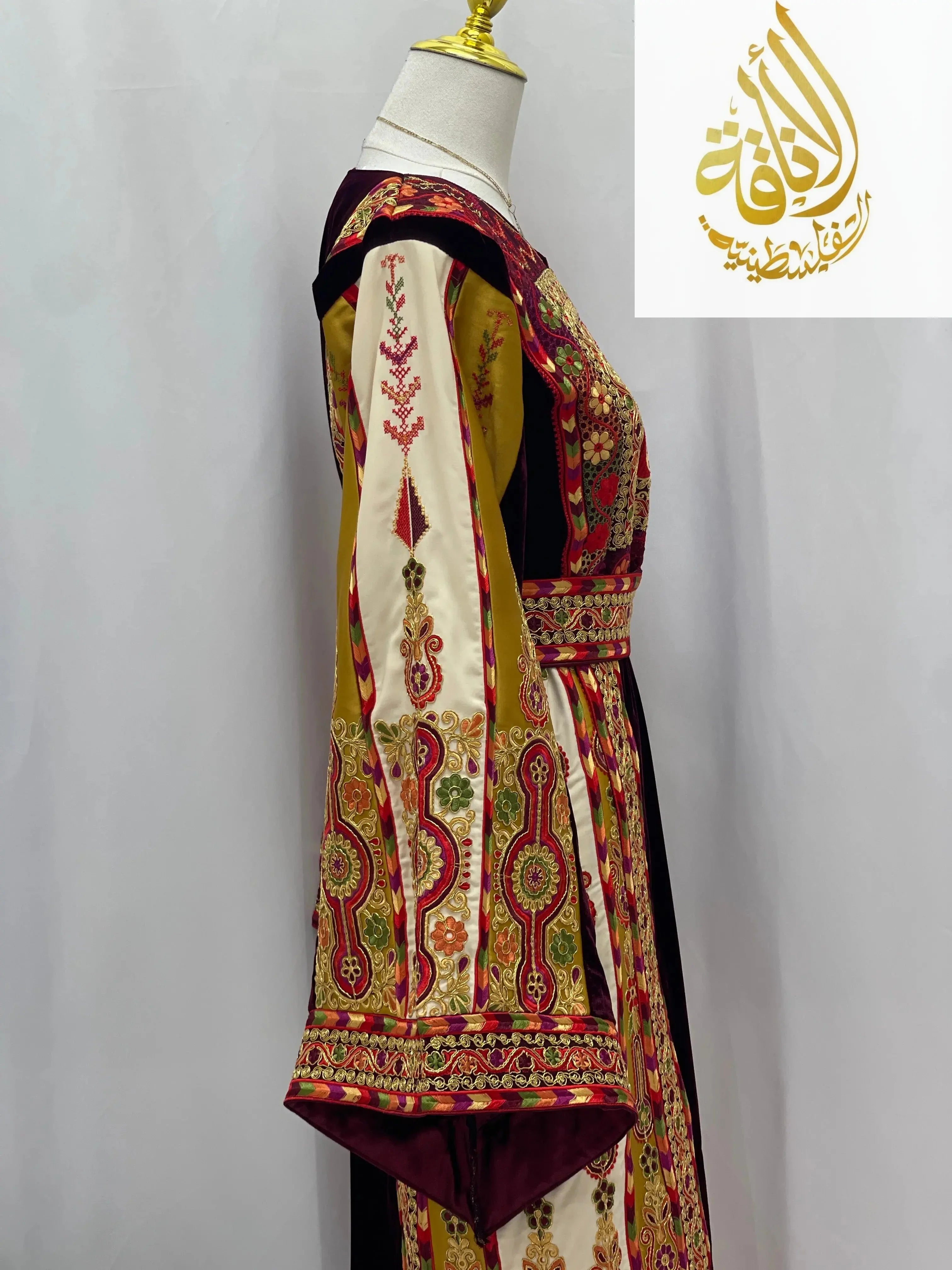 Deep Burgundy Palestinian Embroidered thobe with intricate multicolor floral and geometric patterns side view