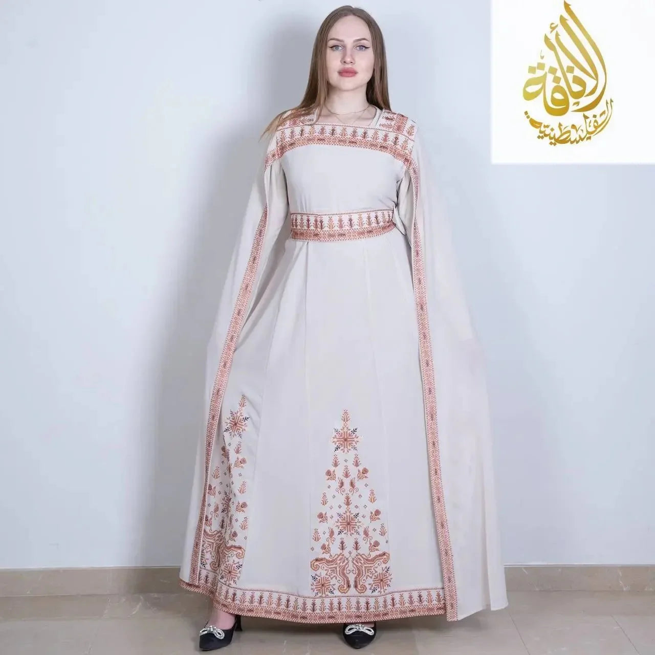 Elegant embroidered Palestinian dress in cream with intricate traditional embroidery by Palestinian Elegance