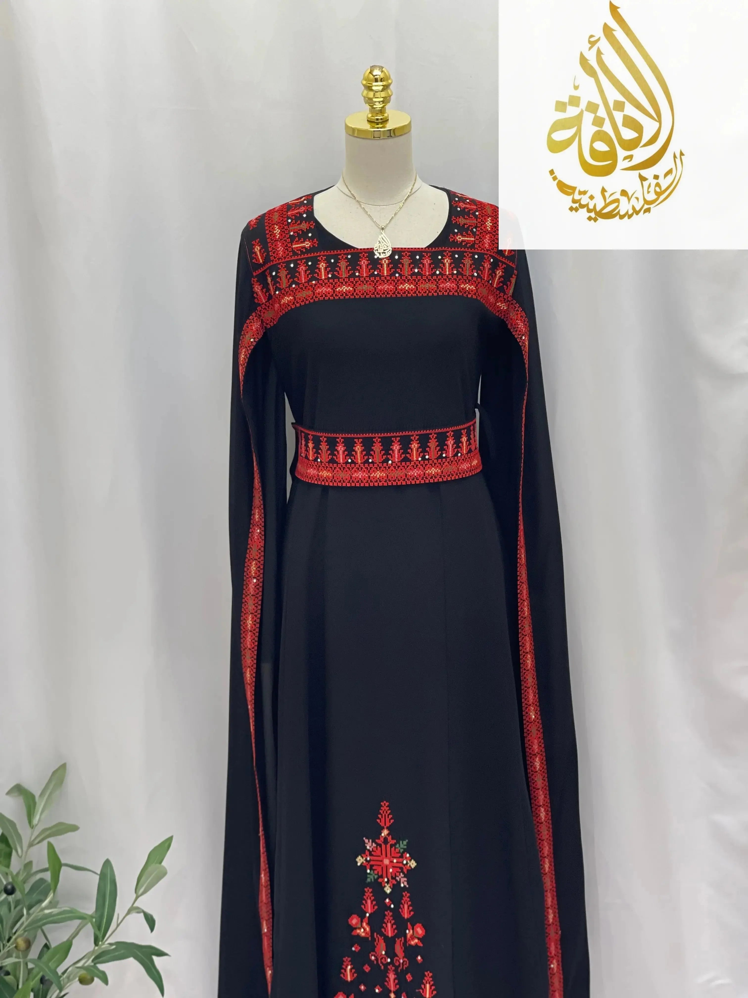 Black embroidered Palestinian dress with red traditional embroidery by Palestinian Elegance