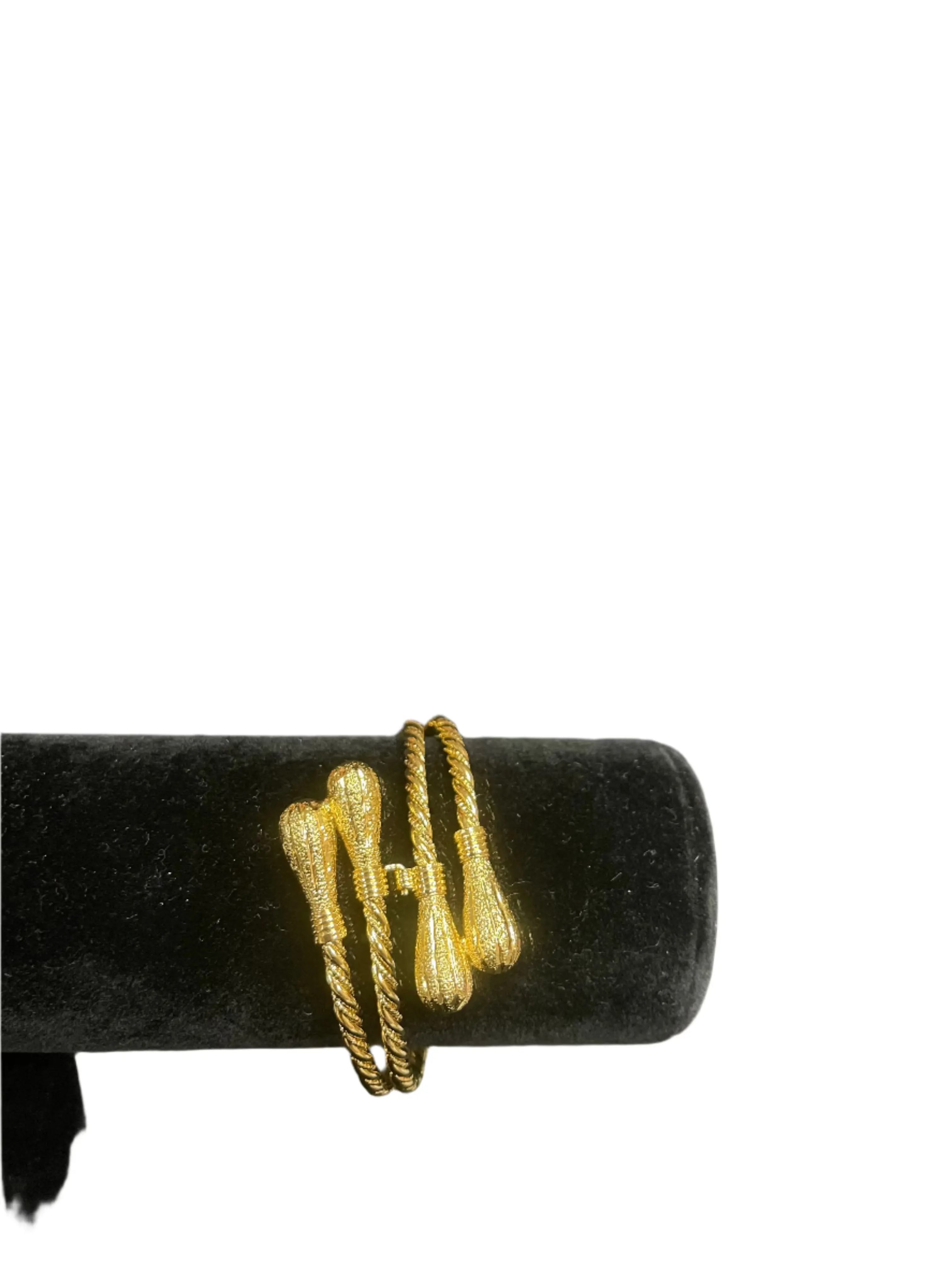 Palestinian gold bangle bracelet in imitated gold with twisted rope design on black display