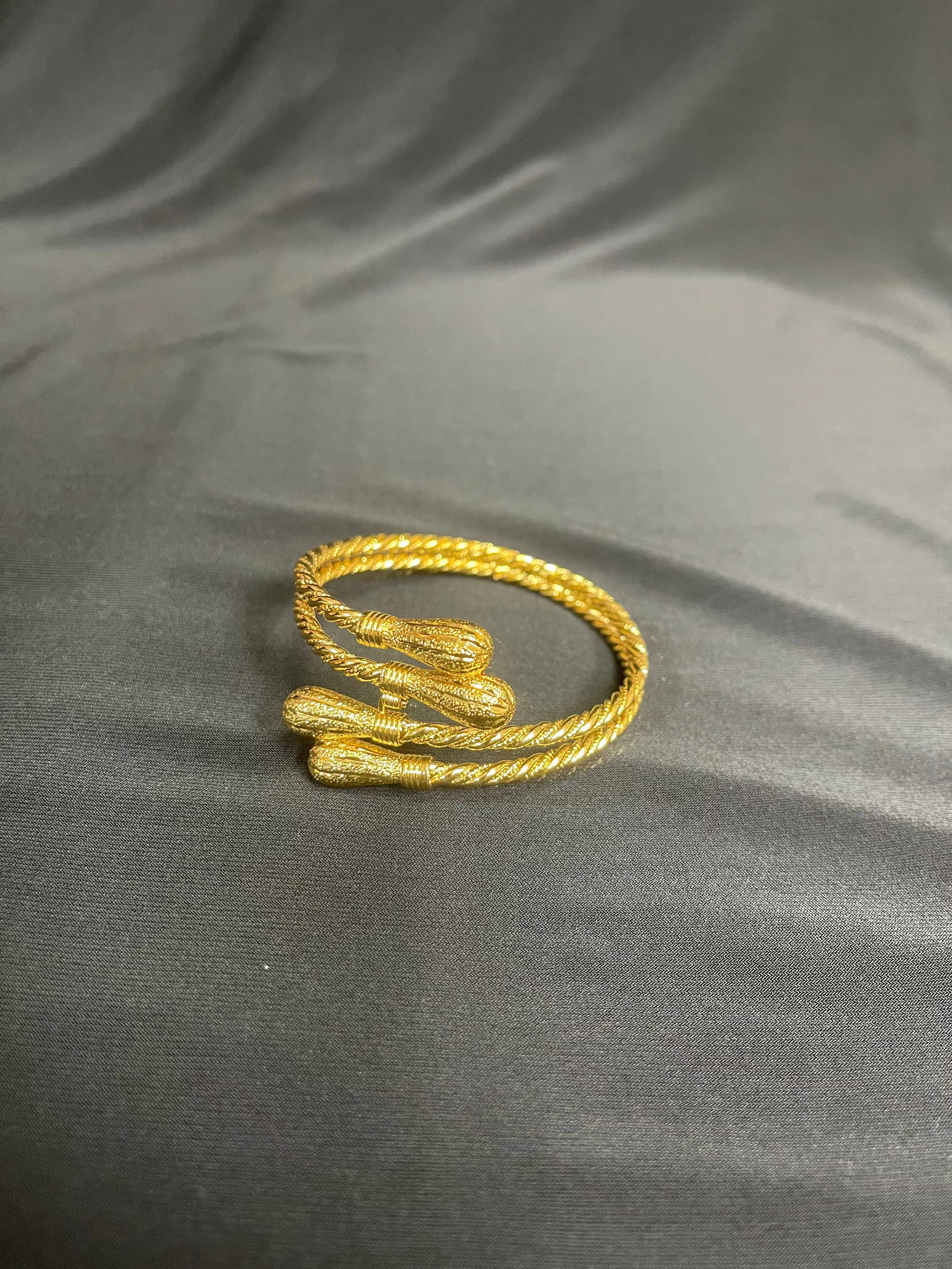 Palestinian gold bangle bracelet in imitated gold with twisted rope design by Palestinian Elegance