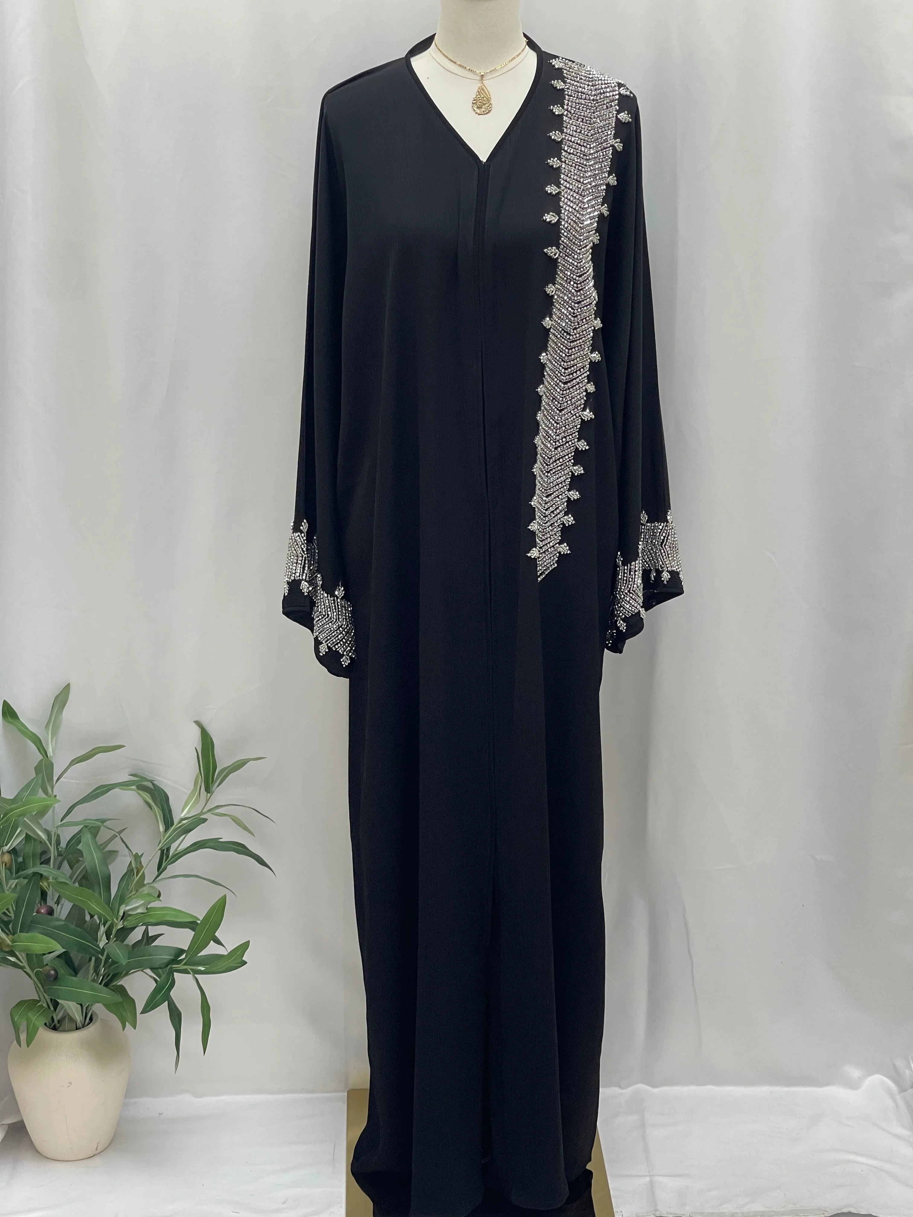 Palestinian Luxury Modest Fashion Abaya in black with silver embroidery on shoulder and cuffs by Palestinian Elegance