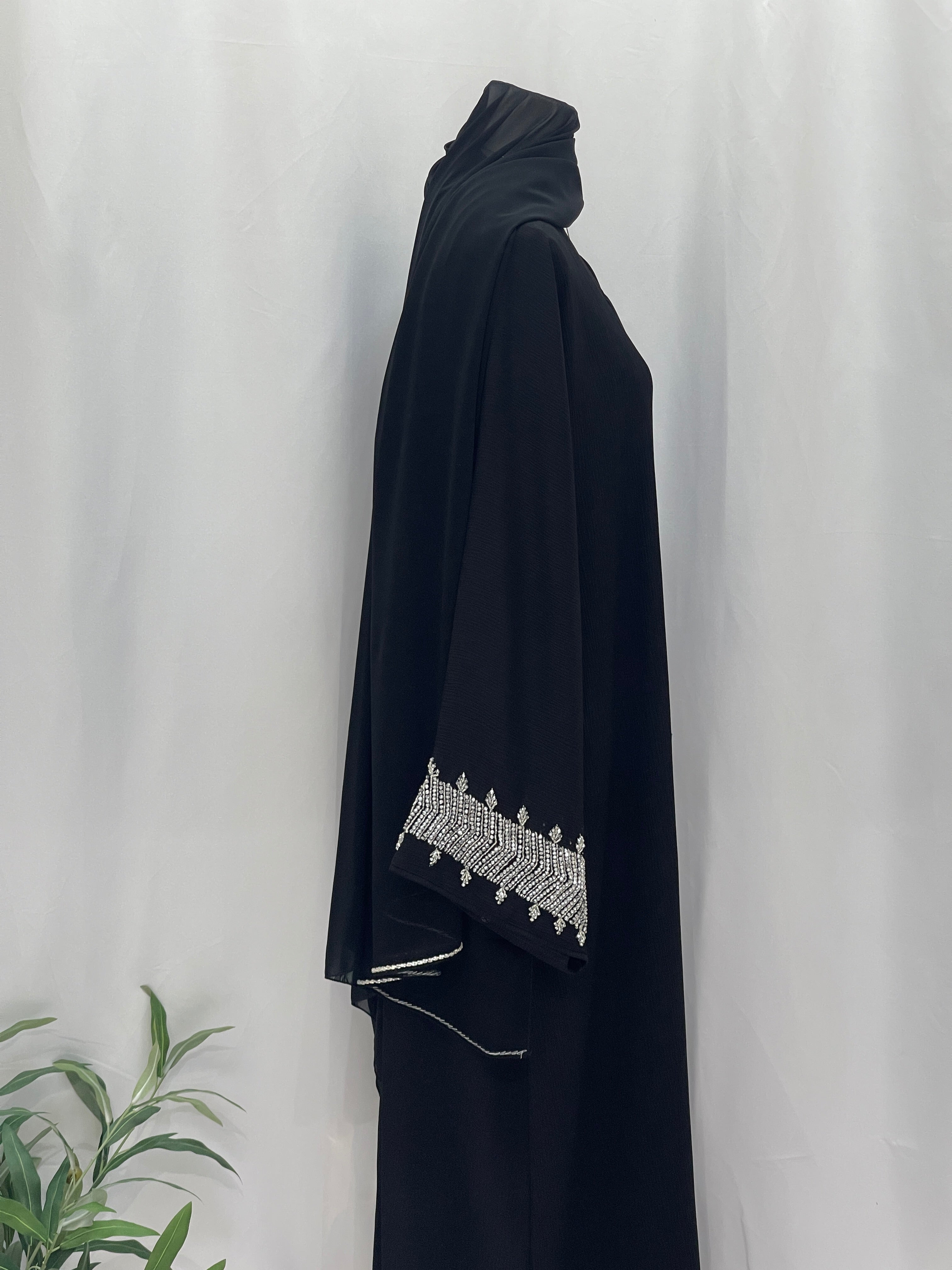 Palestinian Luxury Modest Fashion Abaya in black with white embroidery on sleeves by Palestinian Elegance