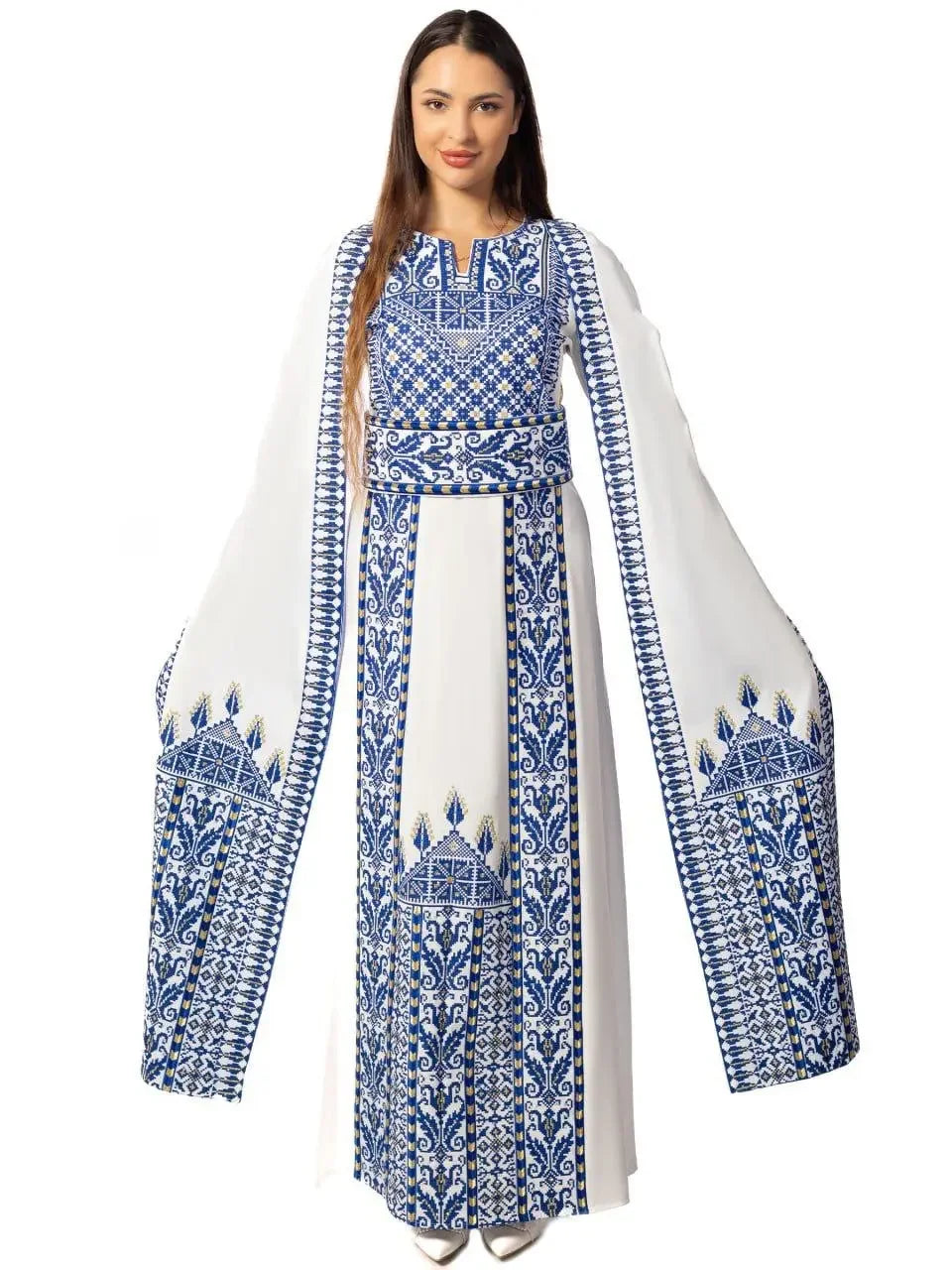 Embroidered Palestinian thobe dress in white with intricate blue embroidery and long wide sleeves