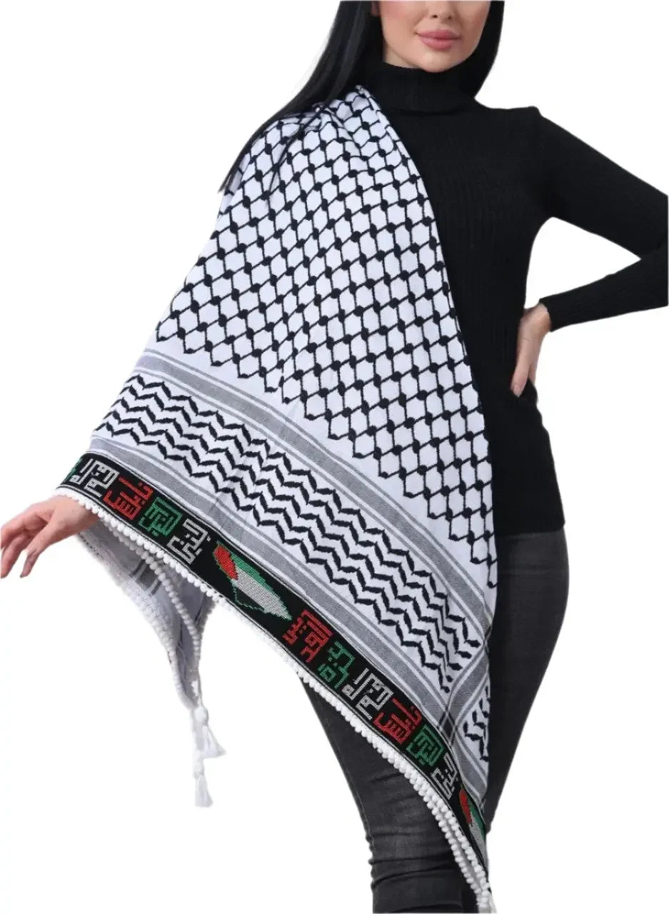 Embroidered Palestinian kuffiyeh draped over shoulder worn by woman in black turtleneck sweater