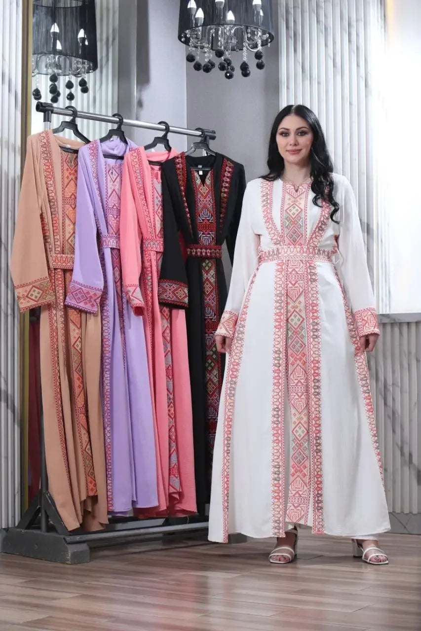 Embroidered abaya for women by Palestinian Elegance displayed in multiple colors with woman modeling white abaya