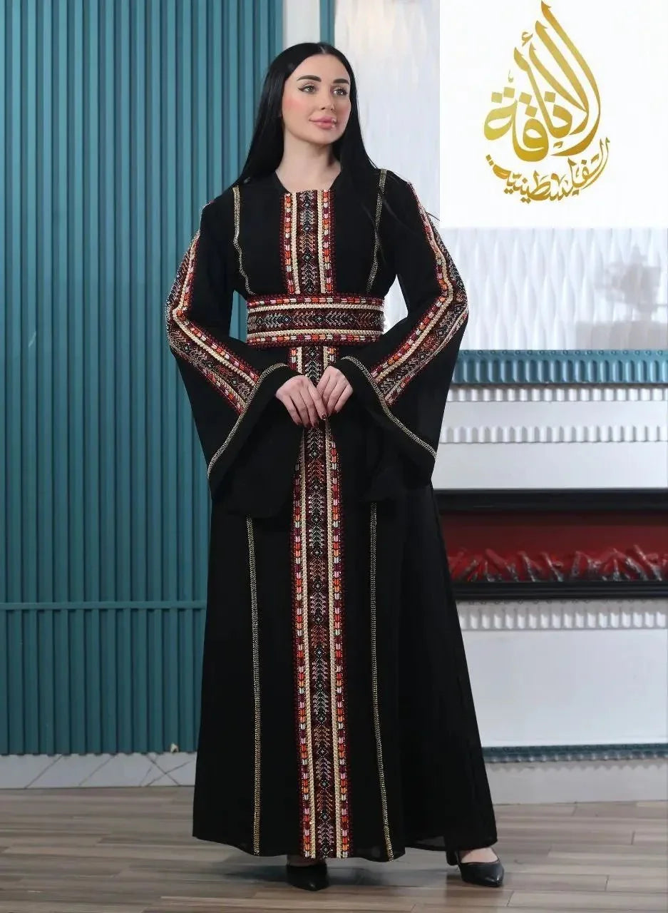 Black embroidered Palestinian kaftan with colorful traditional patterns and wide sleeves by Palestinian Elegance