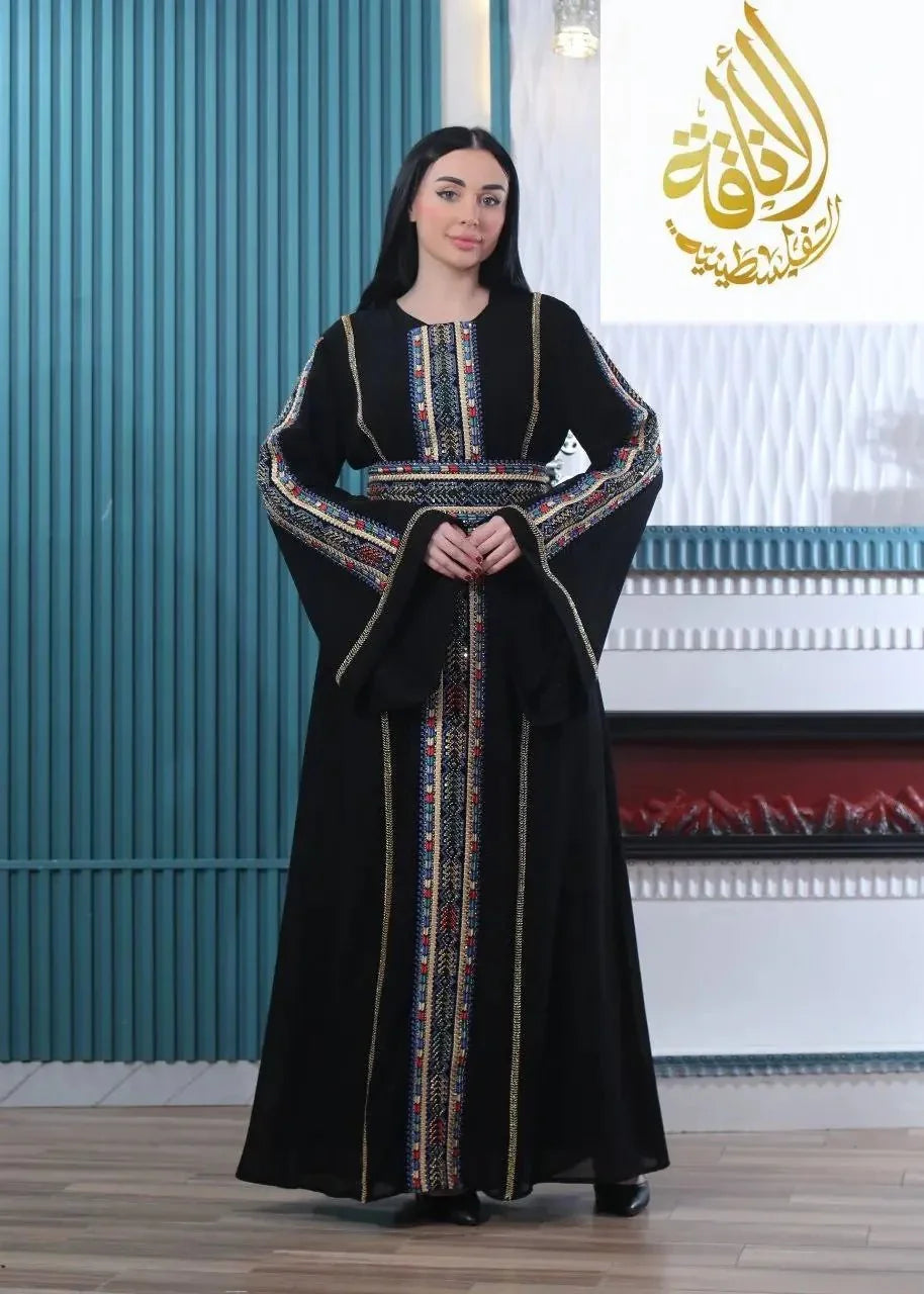 Embroidered Palestinian kaftan in black with colorful traditional embroidery on sleeves and front panel