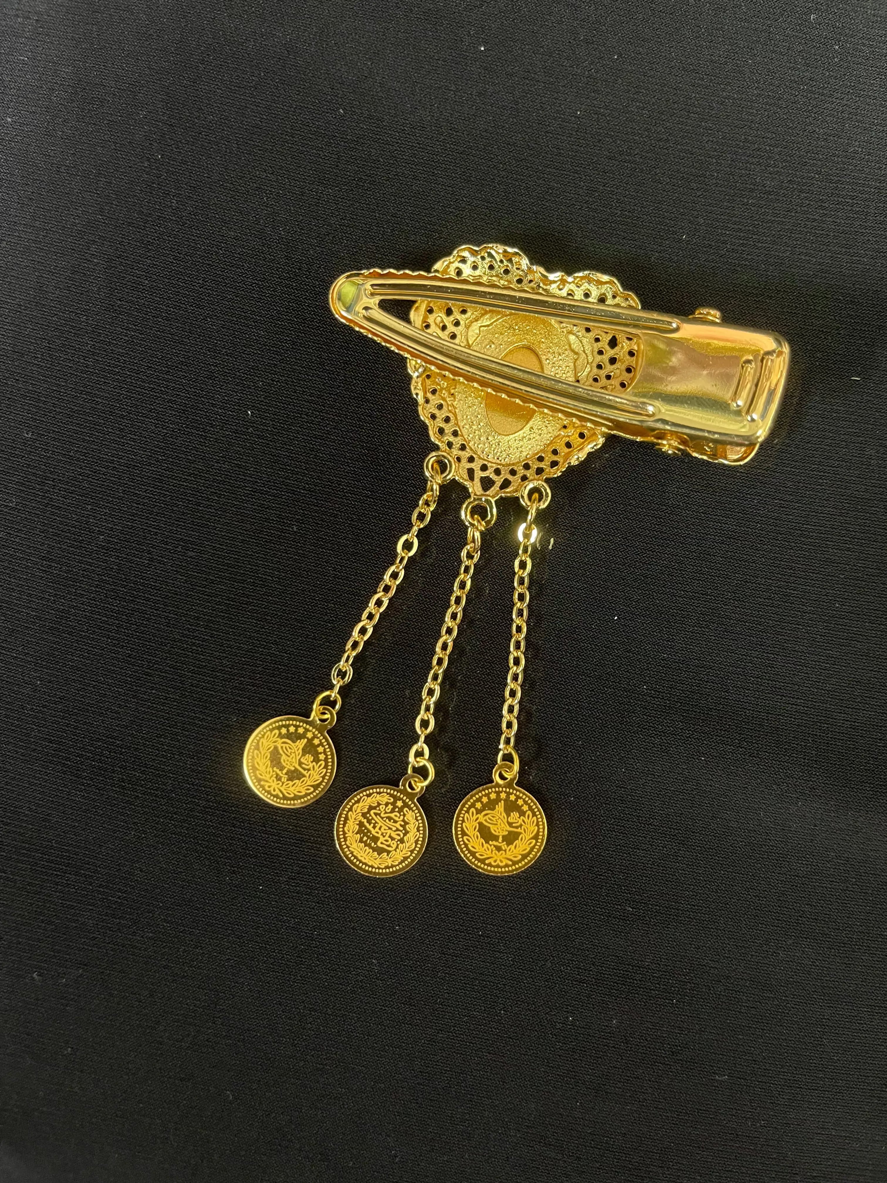 Palestinian Elegance imitated gold hair clip with intricate filigree and dangling coin charms
