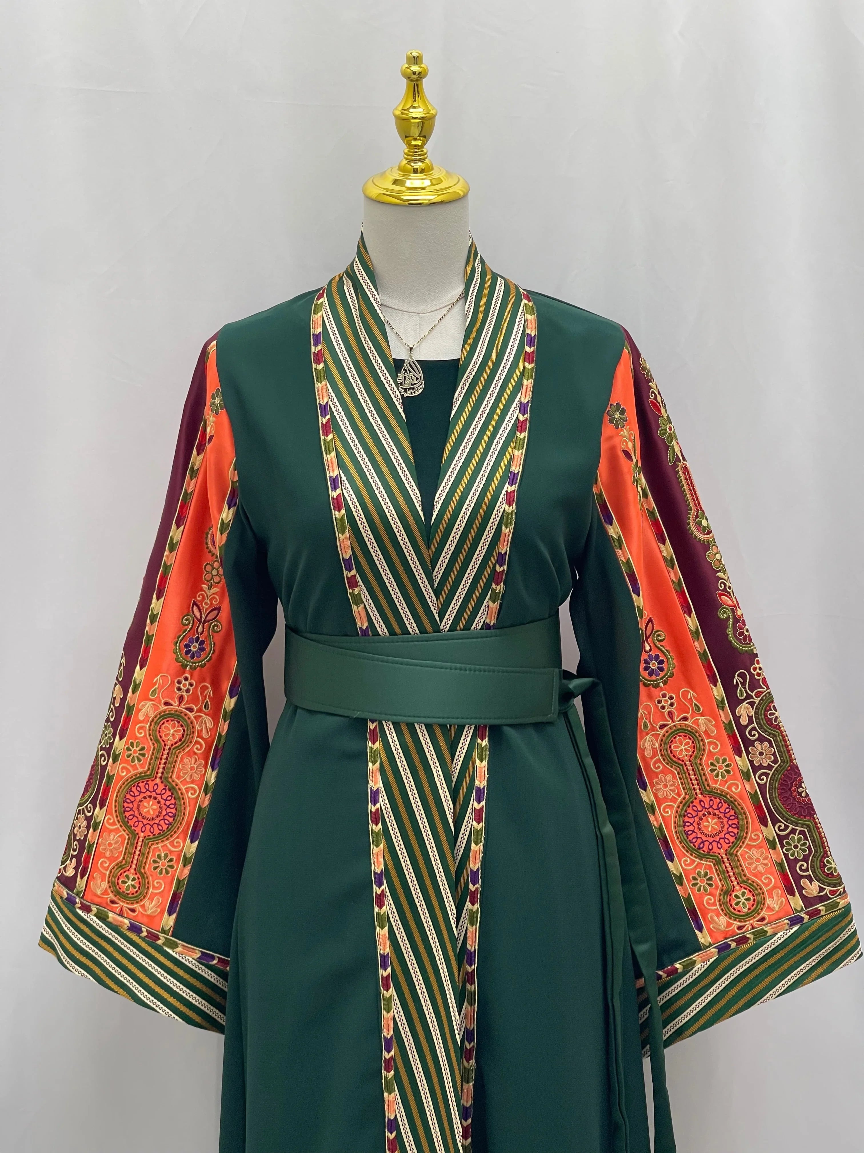Palestinian Elegance cardigan with green fabric and colorful embroidered sleeves, elegant modest fashion bisht style