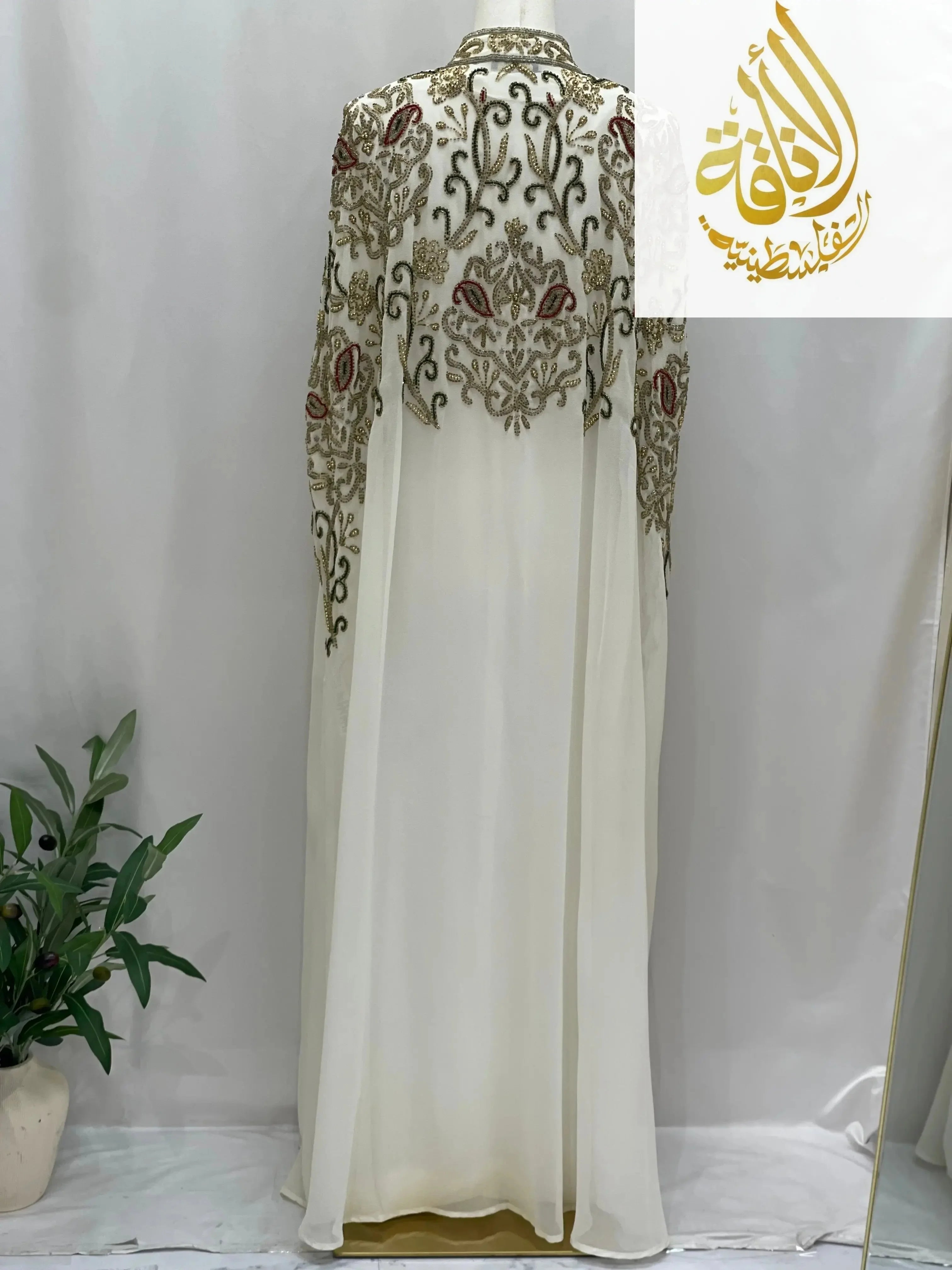 Palestinian Elegance elegant modest fashion cape cardigan with intricate embroidery on back and sleeves in white