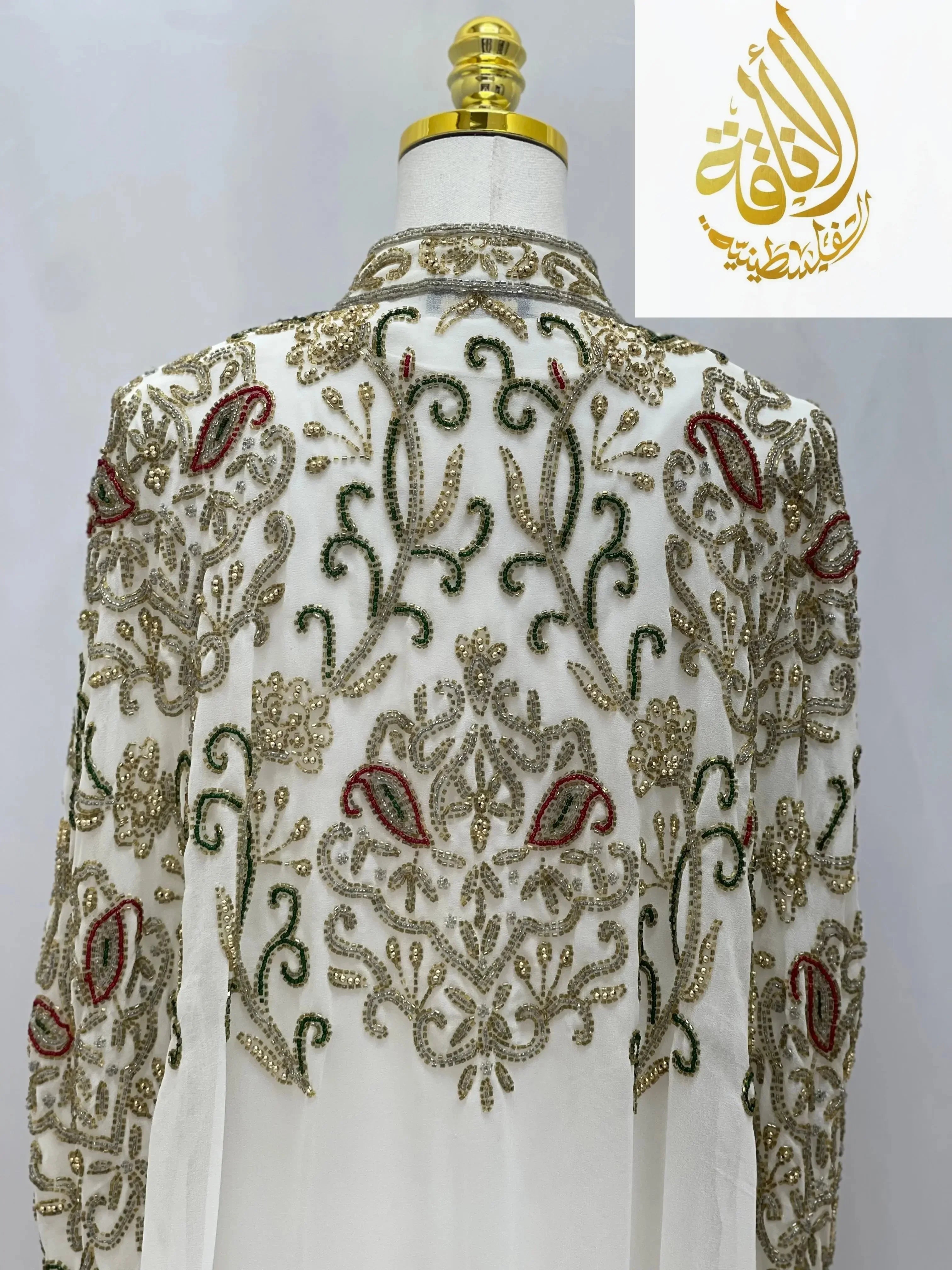 Palestinian Elegance cardigan featuring intricate embroidery in an elegant modest fashion cape design