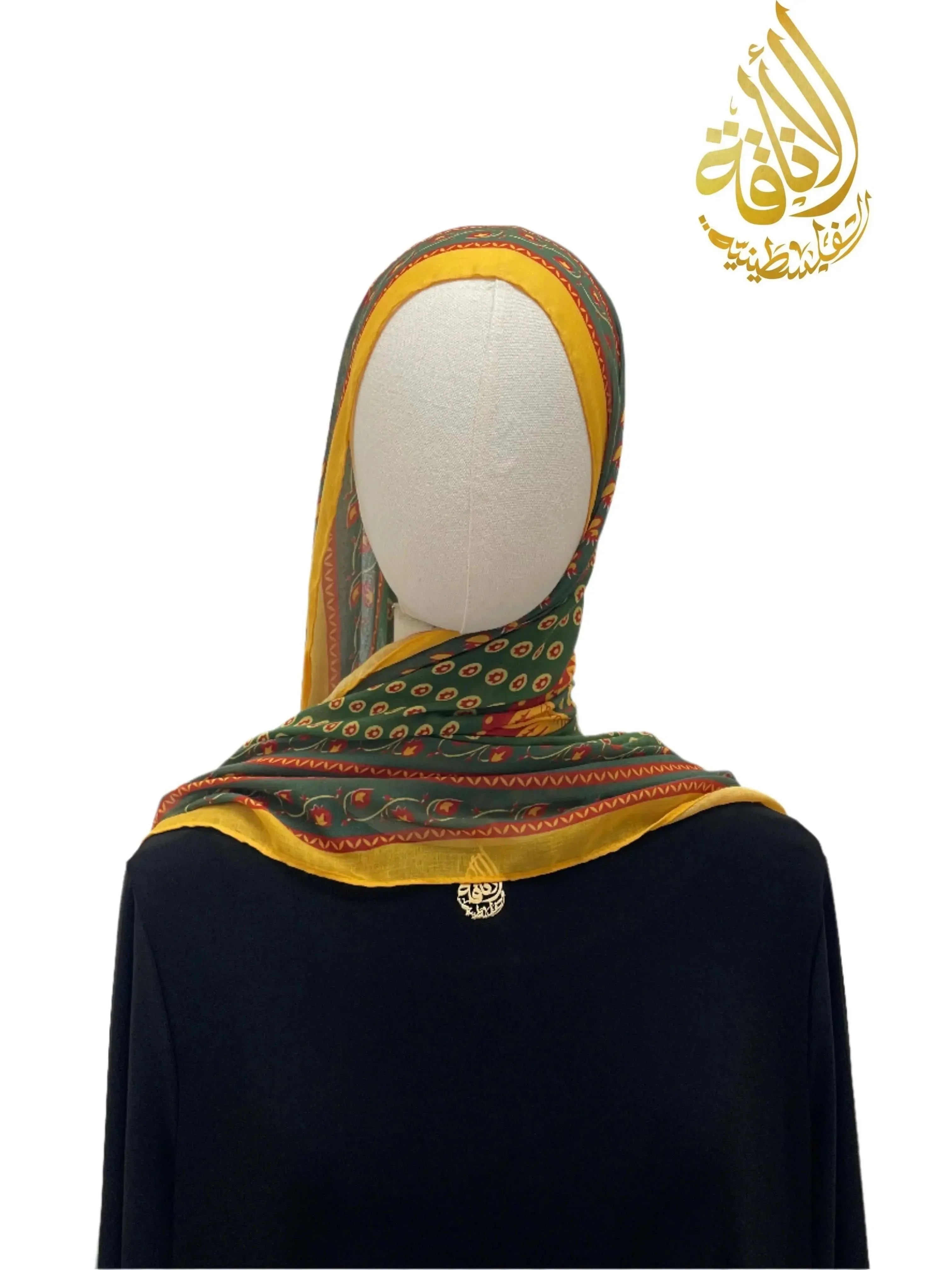 Long Siti Asba Hijab in green and yellow with intricate patterns by Palestinian Elegance