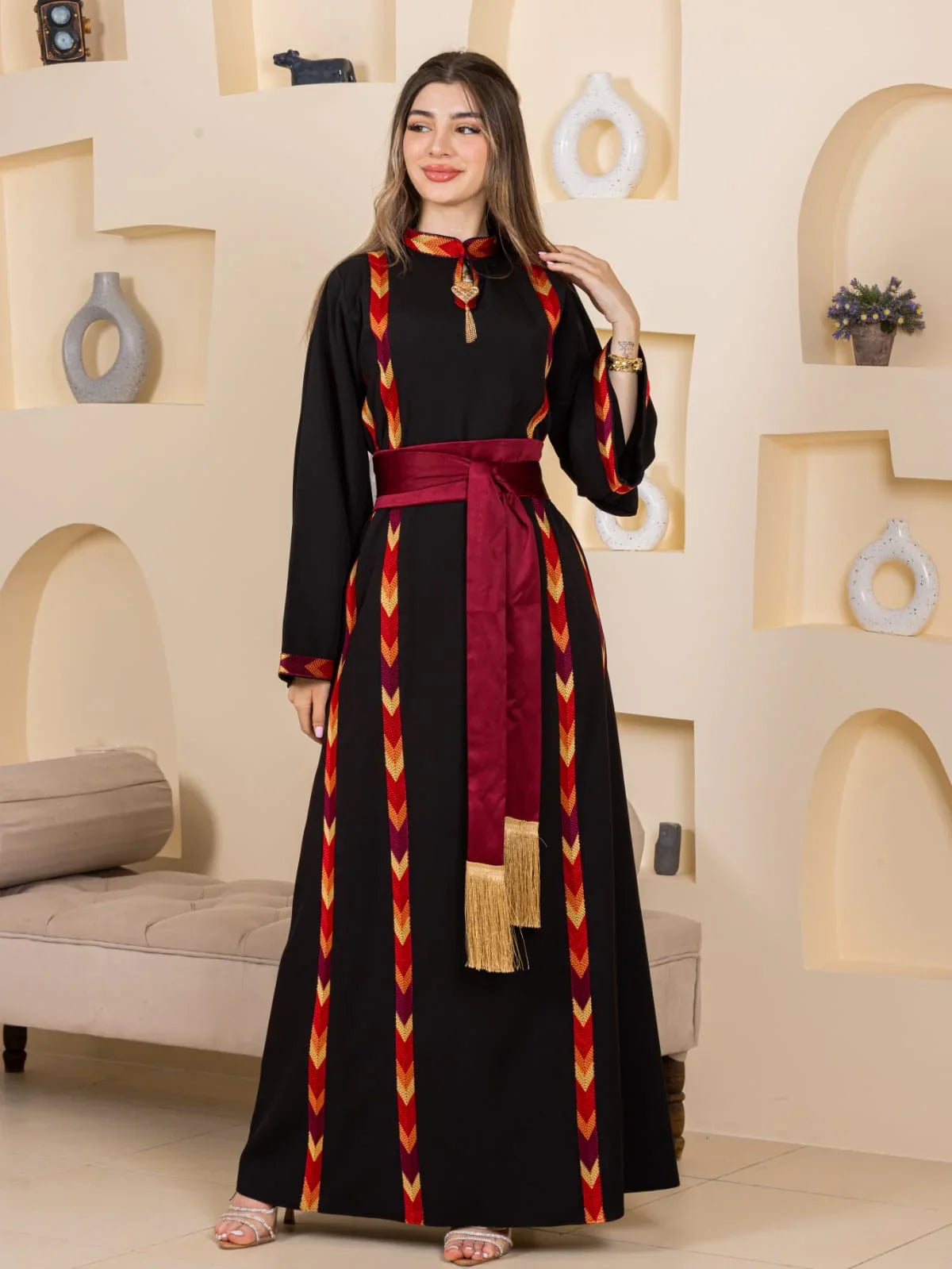 Palestinian Elegance black Embroiderd Thoub Al-Manajel with maroon sash gold tassels and geometric embroidery