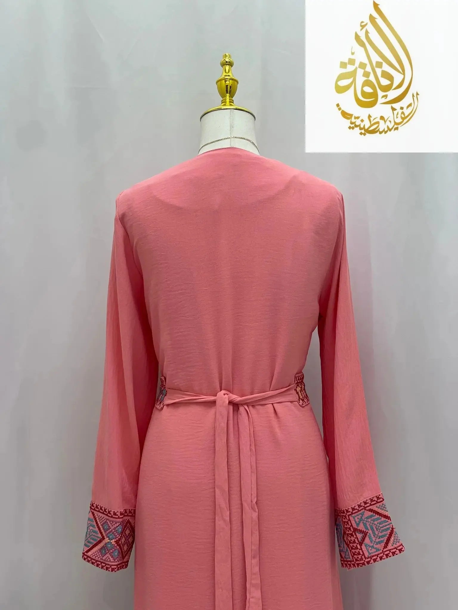 Back view of Palestinian Elegance Embroidered 2Pcs Abaya in pink with detailed sleeve embroidery and waist tie