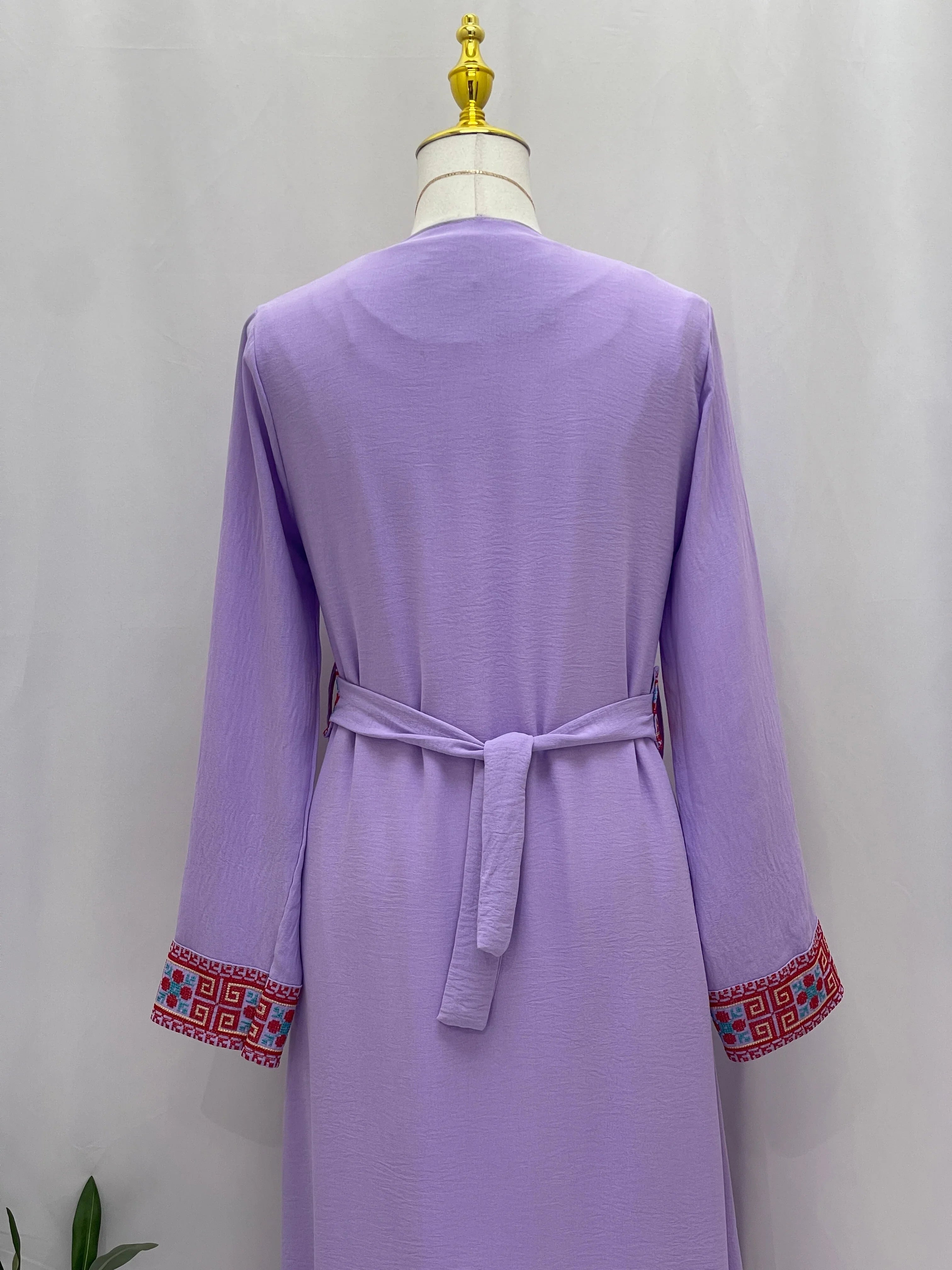 Palestinian Elegance Embroidered Cardigan back view in lavender with waist tie and geometric embroidered cuffs
