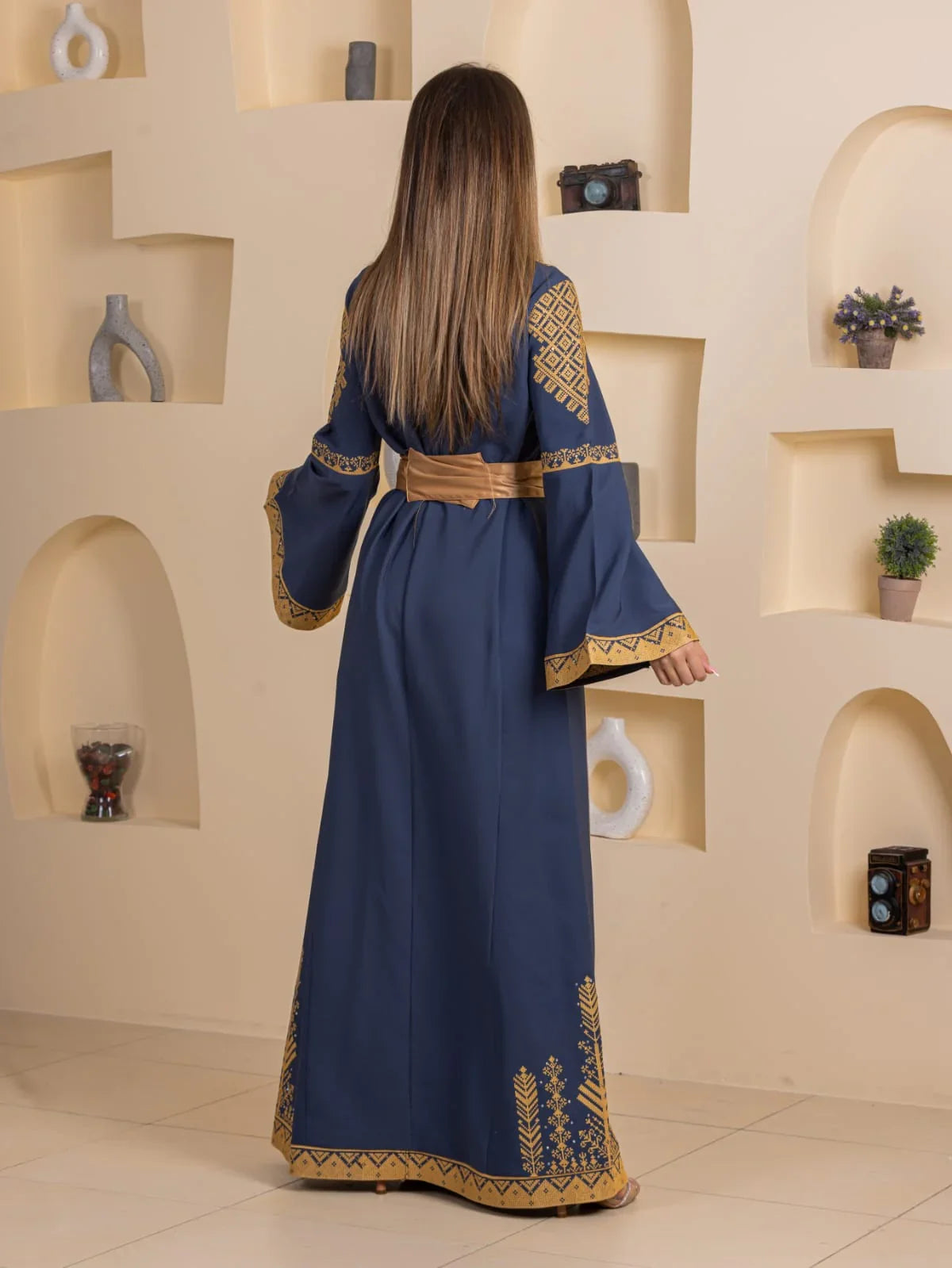 Embroidered Elegance Dress Palestinian Elegance navy blue maxi with gold geometric embroidery on sleeves hem and belt