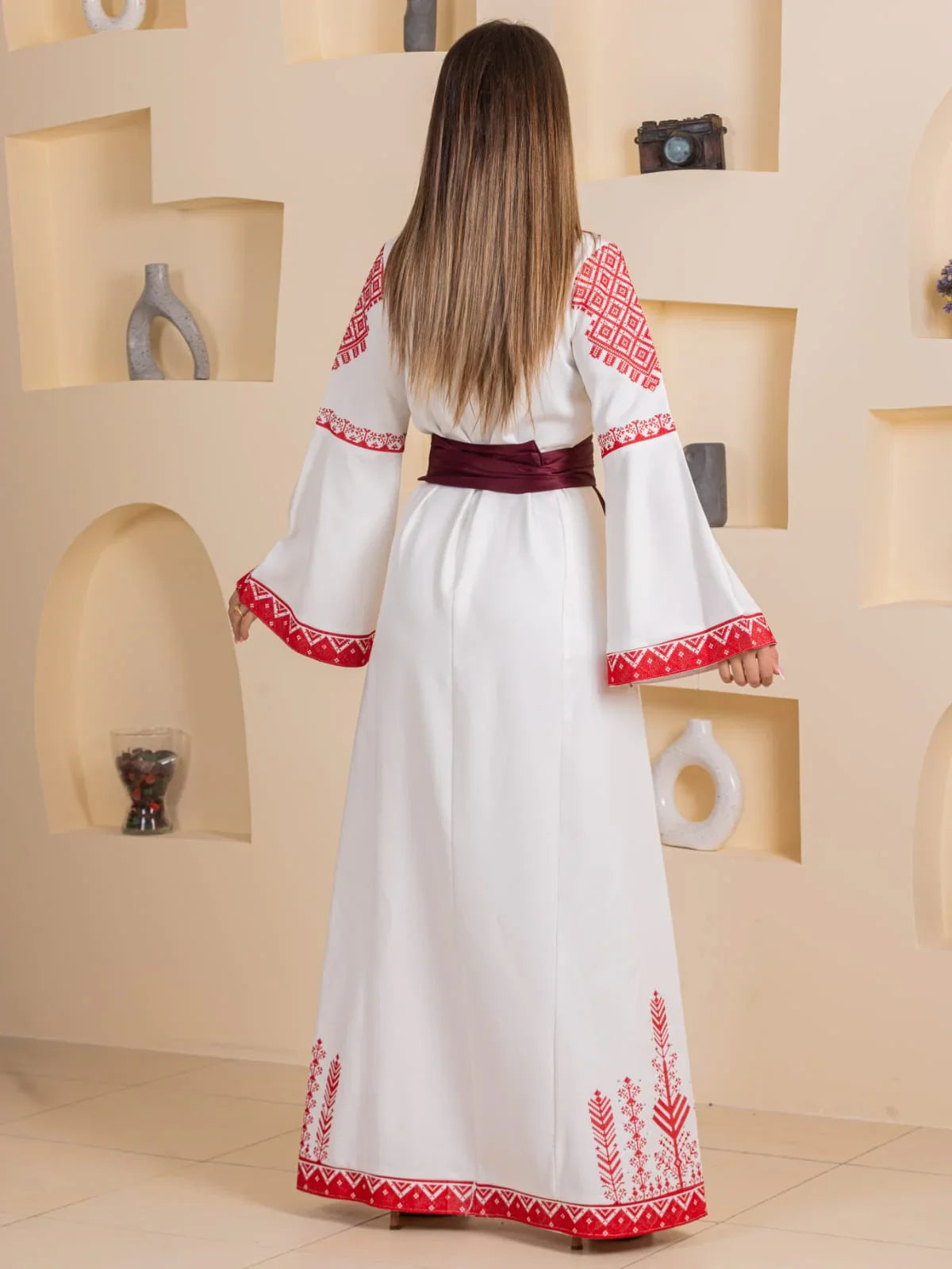 Embroidered Elegance Dress white Palestinian embroidered long gown with red geometric embroidery bell sleeves and maroon sash