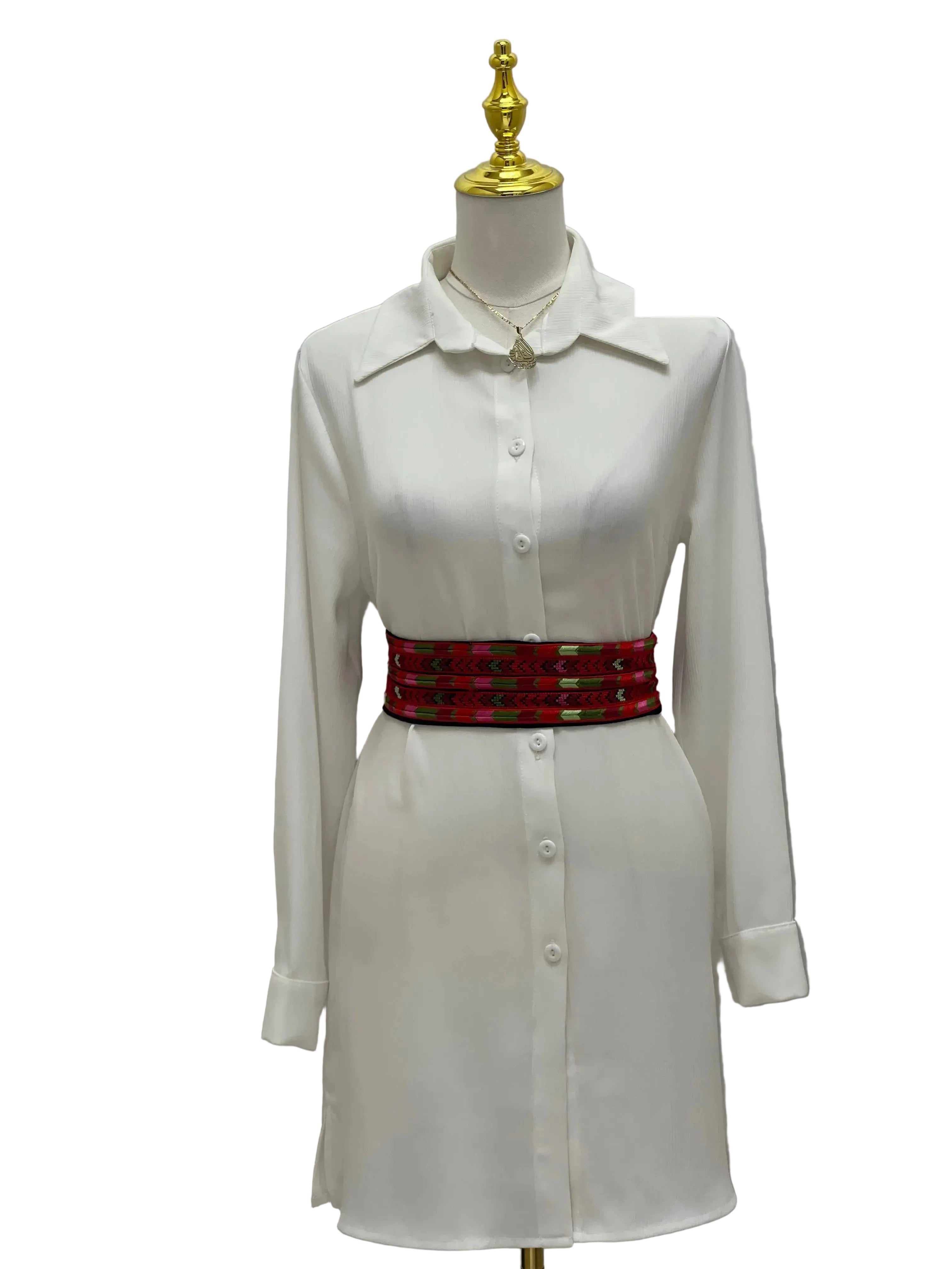 Embroidered Heritage Belt by Palestinian Elegance worn over a white button-up dress with long sleeves