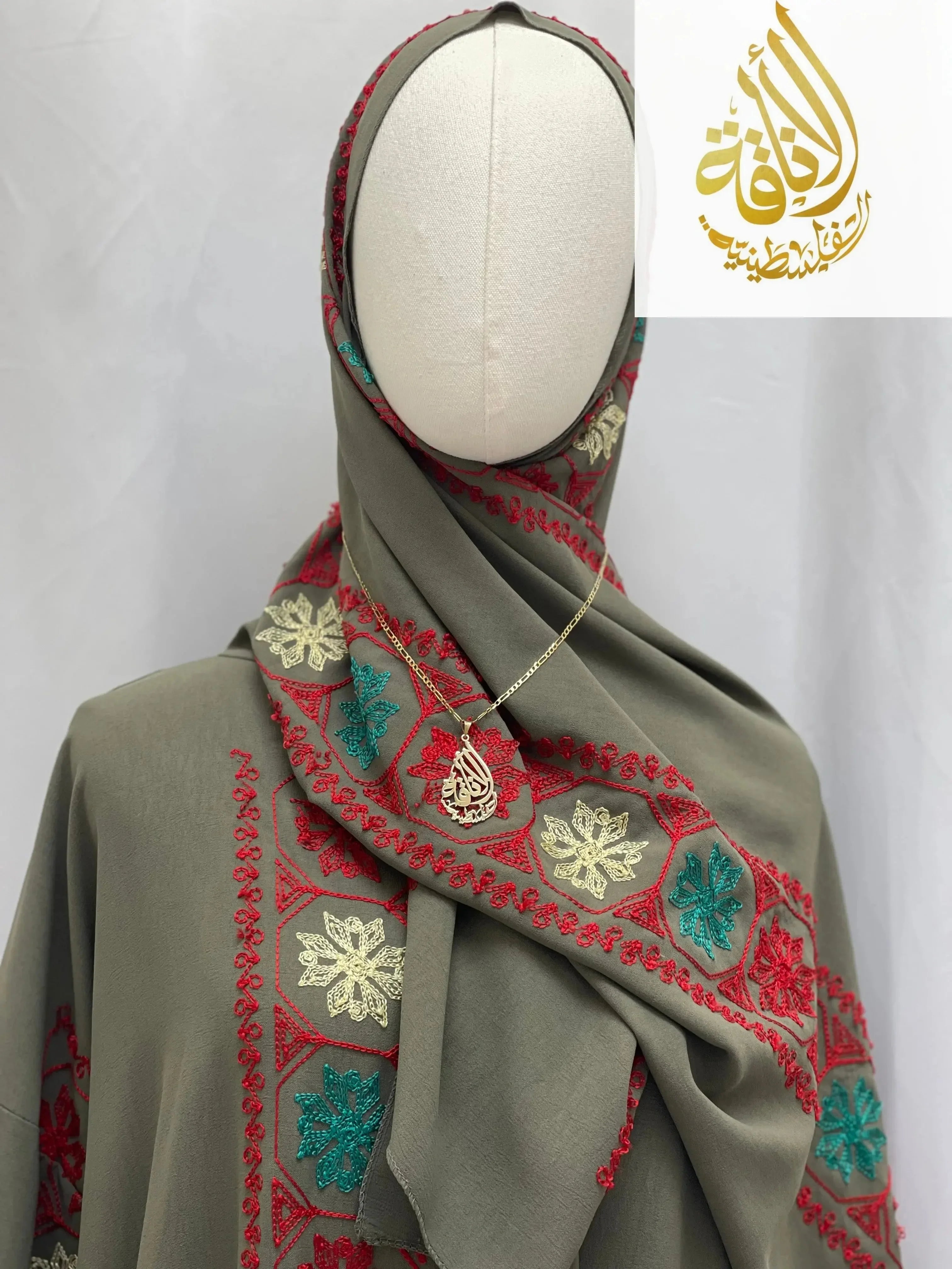 Palestinian Elegance embroidered prayer dress in olive green with red, turquoise, and cream floral embroidery