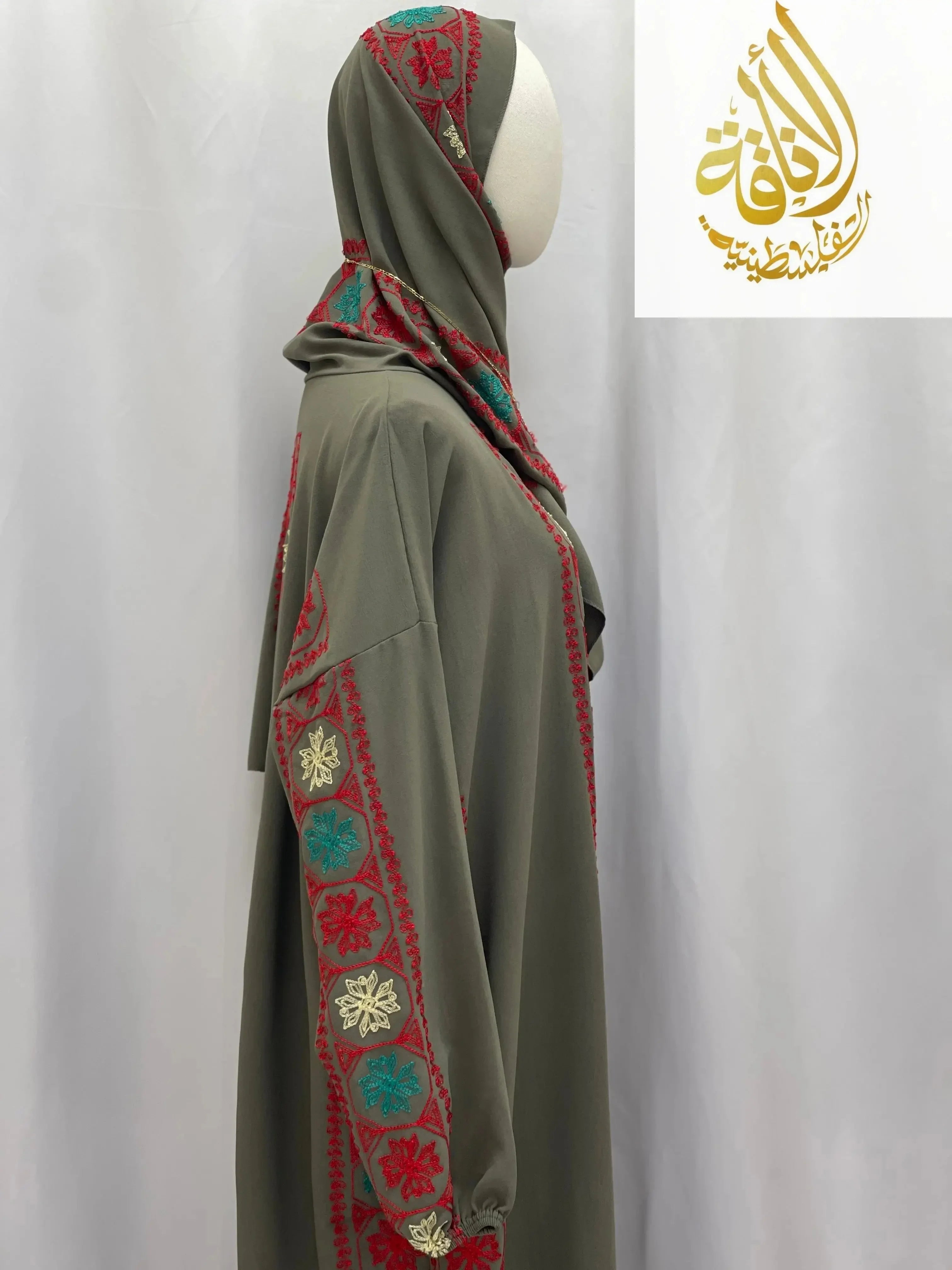 Palestinian Elegance embroidered prayer dress in olive green with red and turquoise embroidery on sleeves and hood