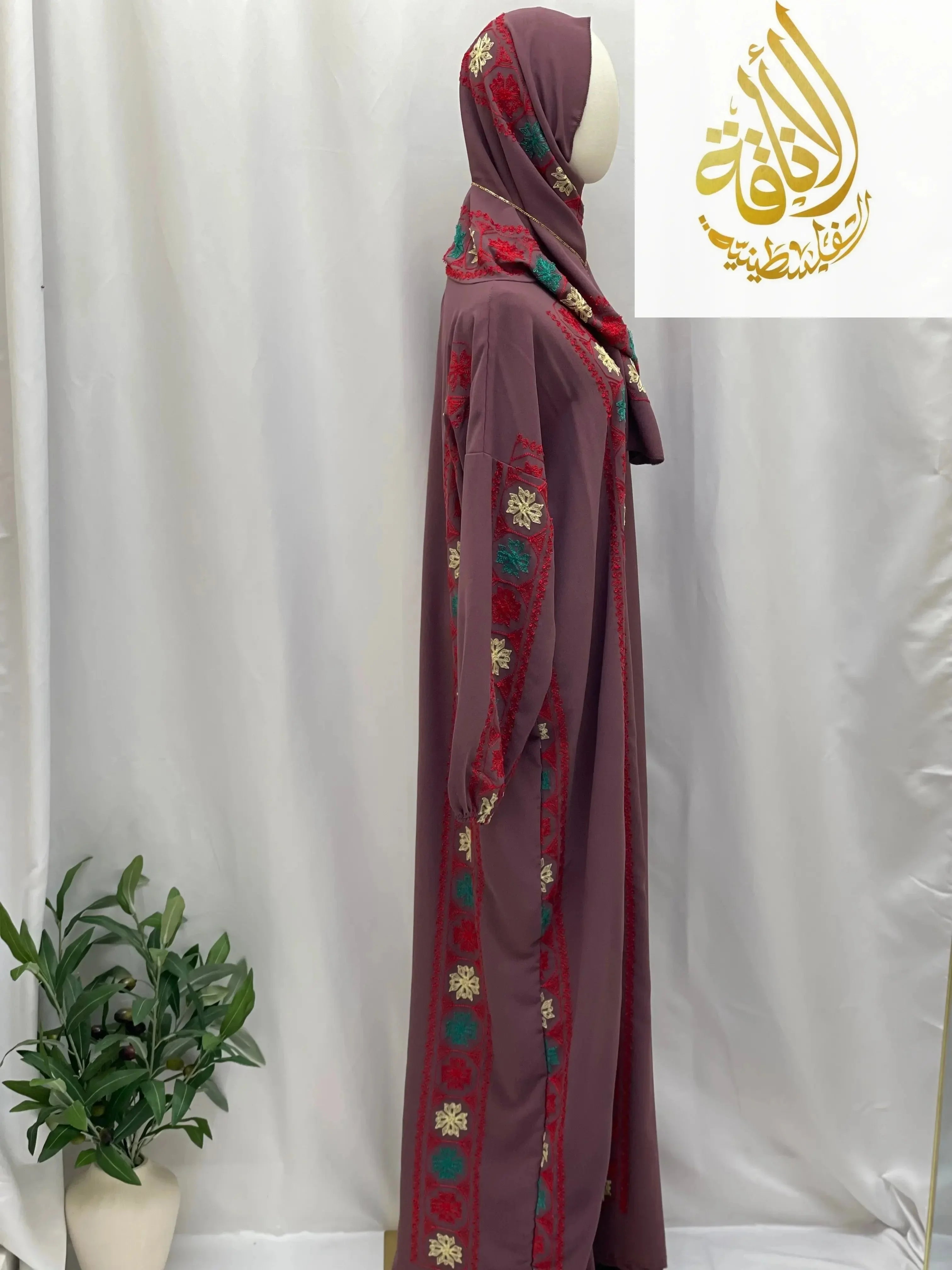 Embroidered prayer dress by Palestinian Elegance in maroon with colorful floral embroidery and matching headscarf
