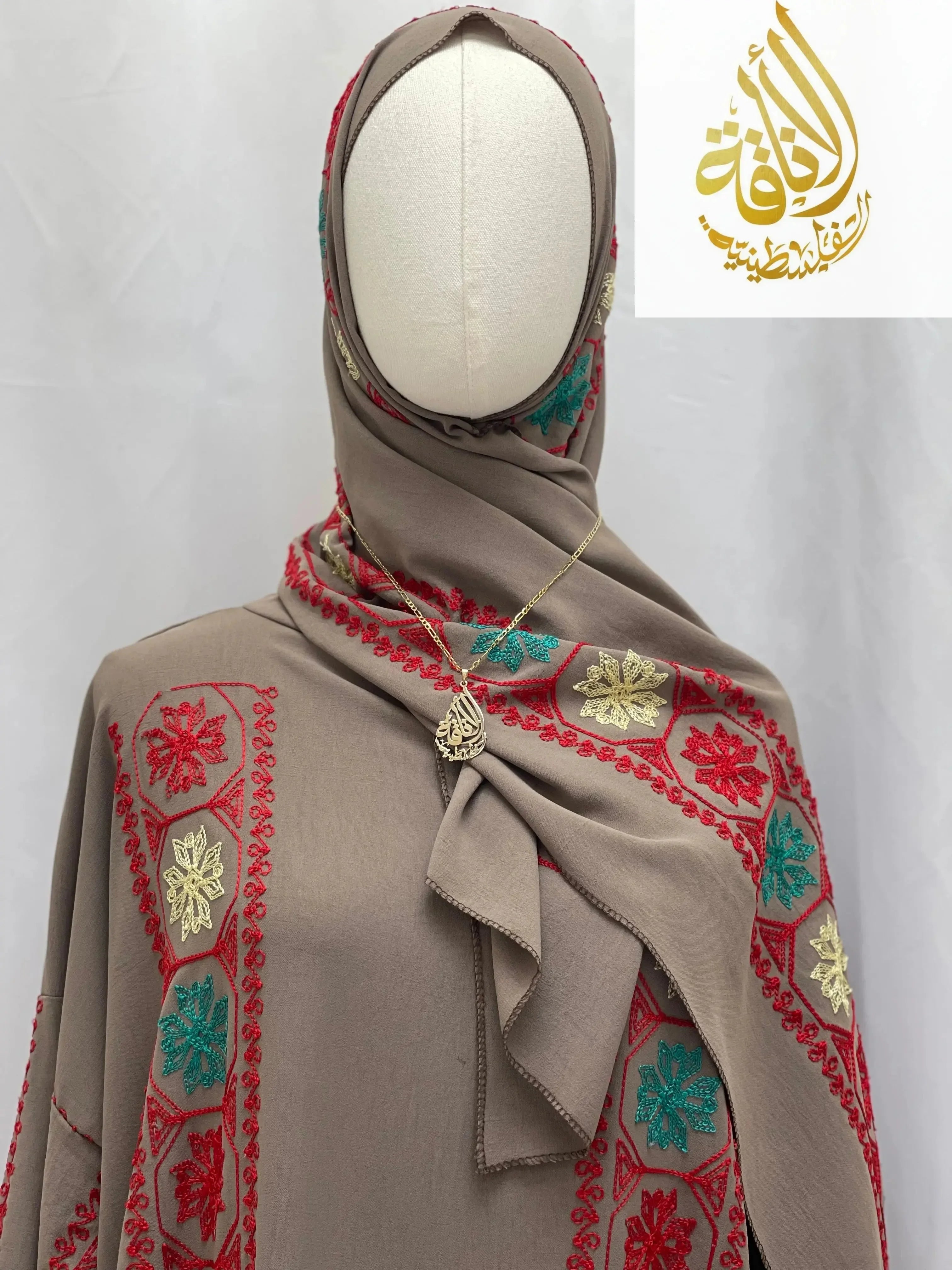 Palestinian Elegance embroidered prayer dress in beige with red green and gold floral embroidery details